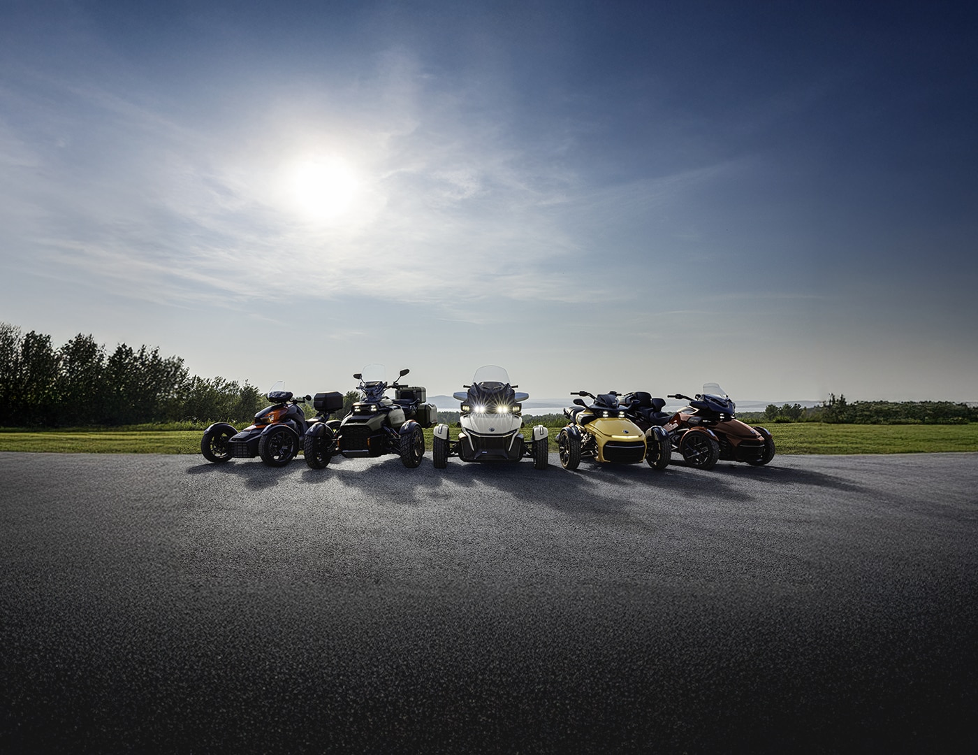 All Can-Am three-wheel motorcycles parked side by side