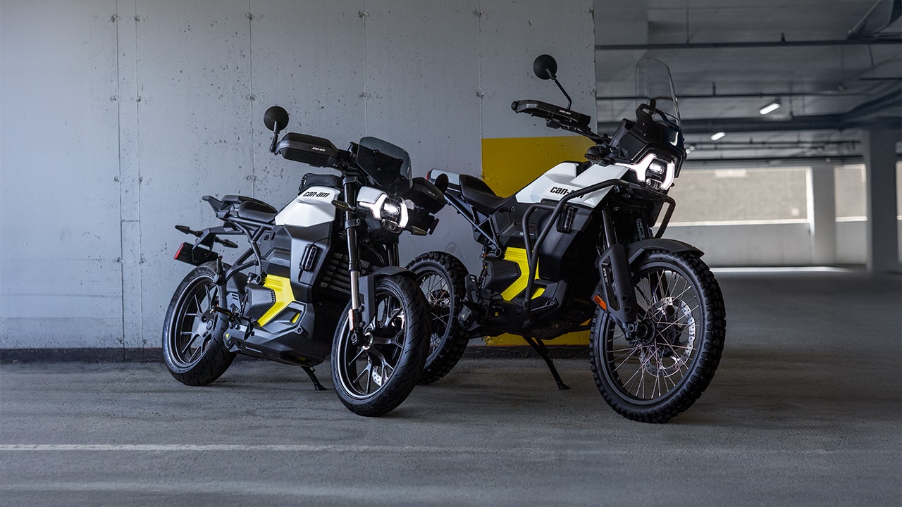 Can-Am Pulse & Origin electric motorcycles parked in a multi-story parking garage