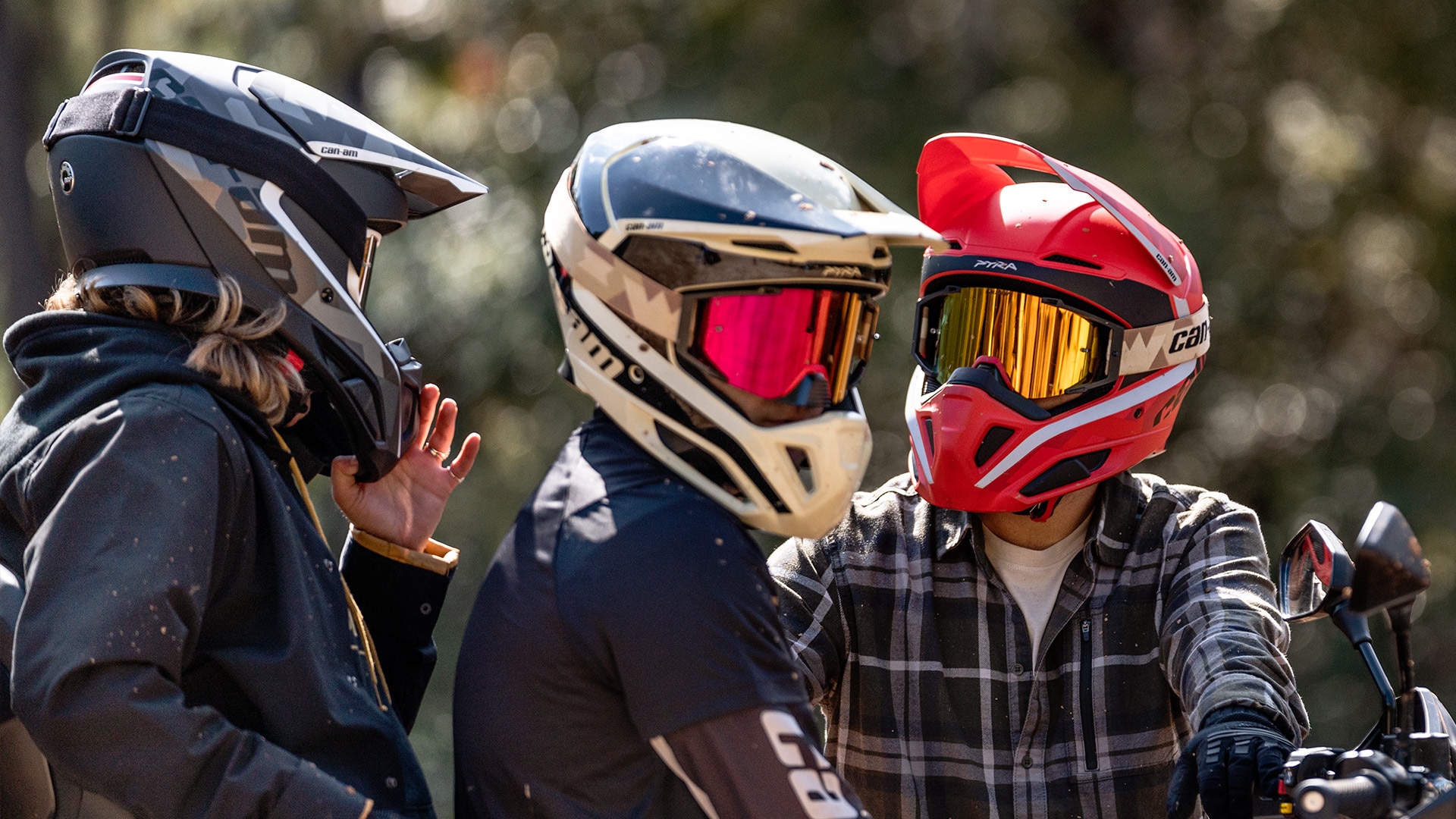 Three riders wearing Pyra safety helmets