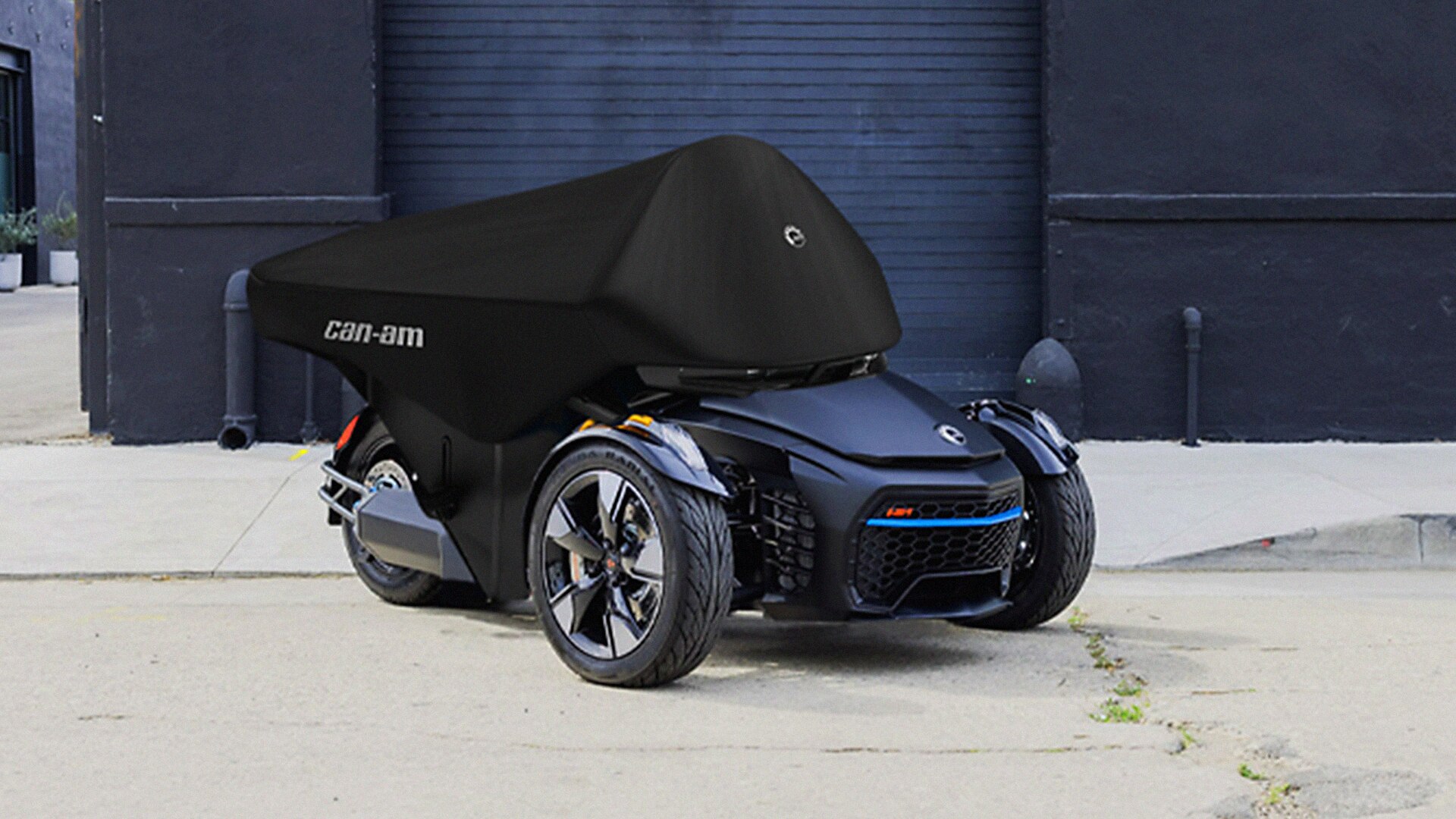 Can-Am 3-wheel vehicle under a storage cover