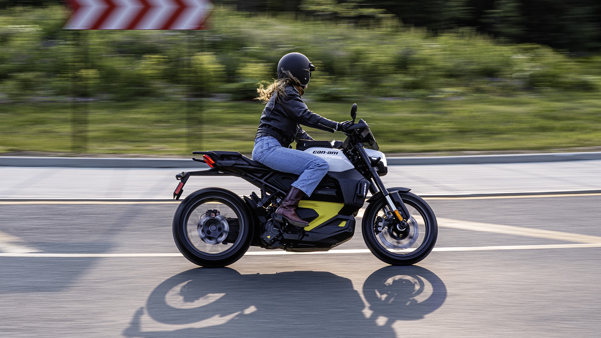 Rider on 2026 Can-Am Pulse electric motorcycle in a city street
