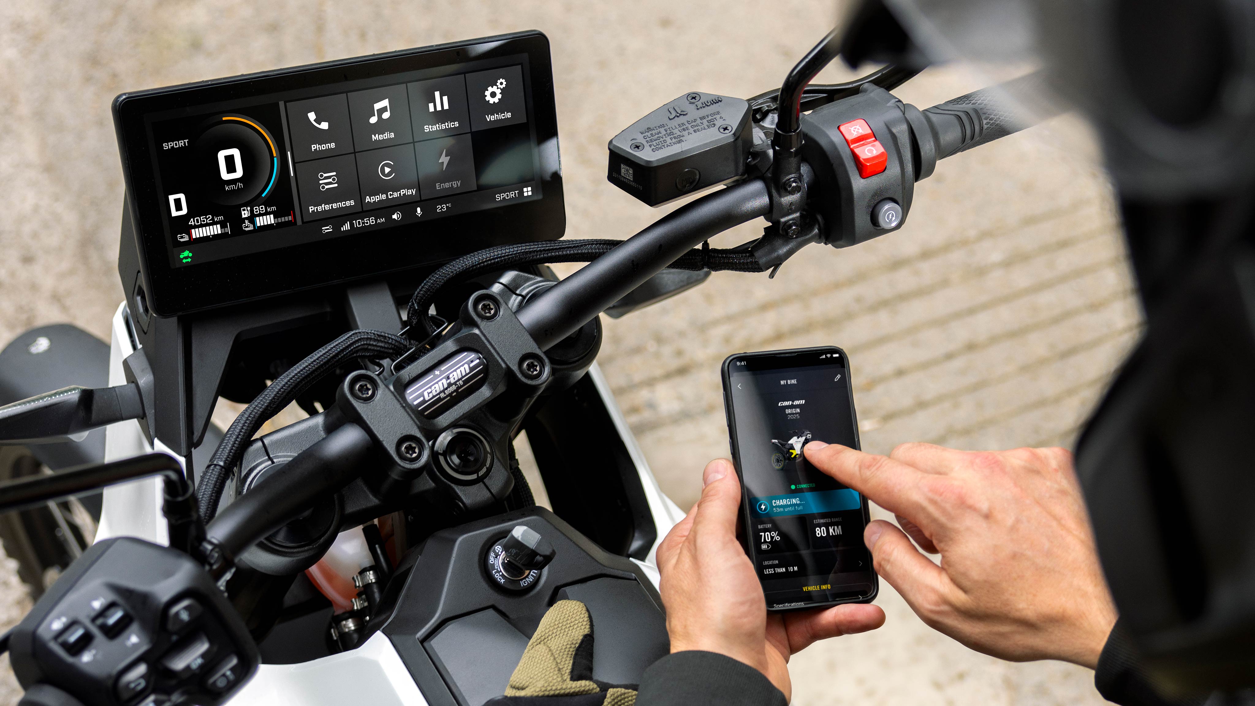 A motorcyclist ready to link his phone to his Can-Am electric motorcycle