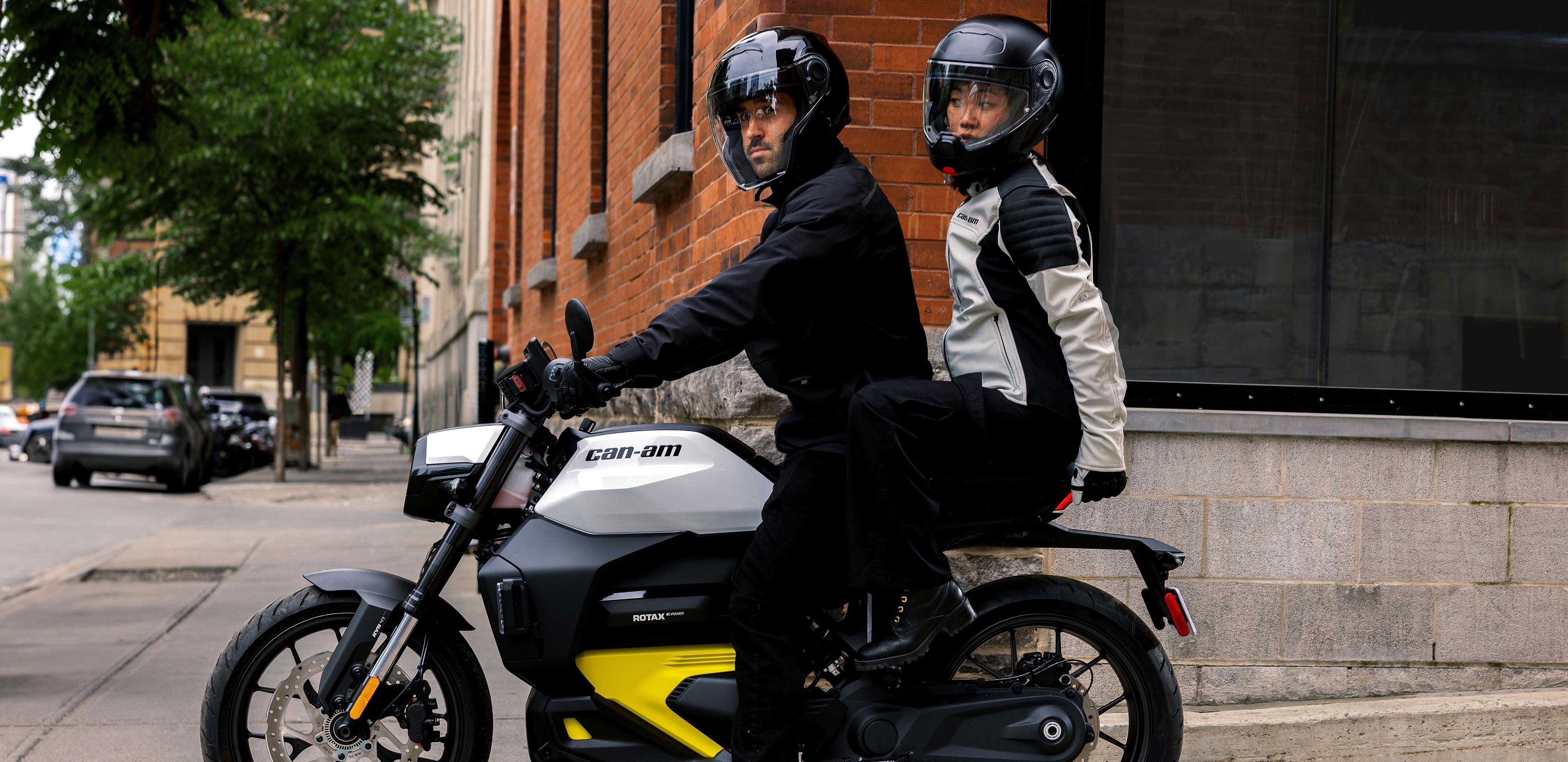 Two people aboard Can-Am's 100% electric motorcycle