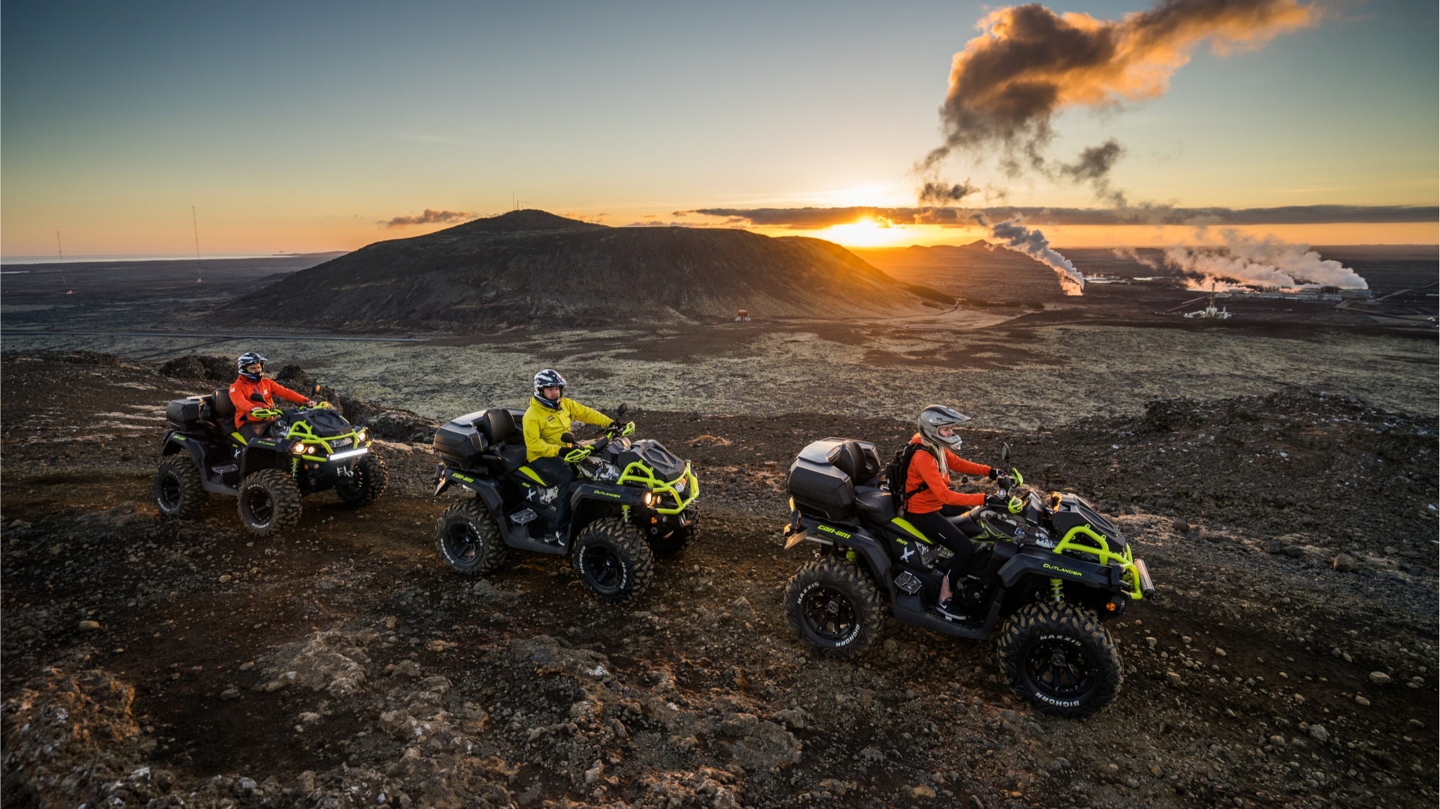 Group riding their ATV in the desert at sun down