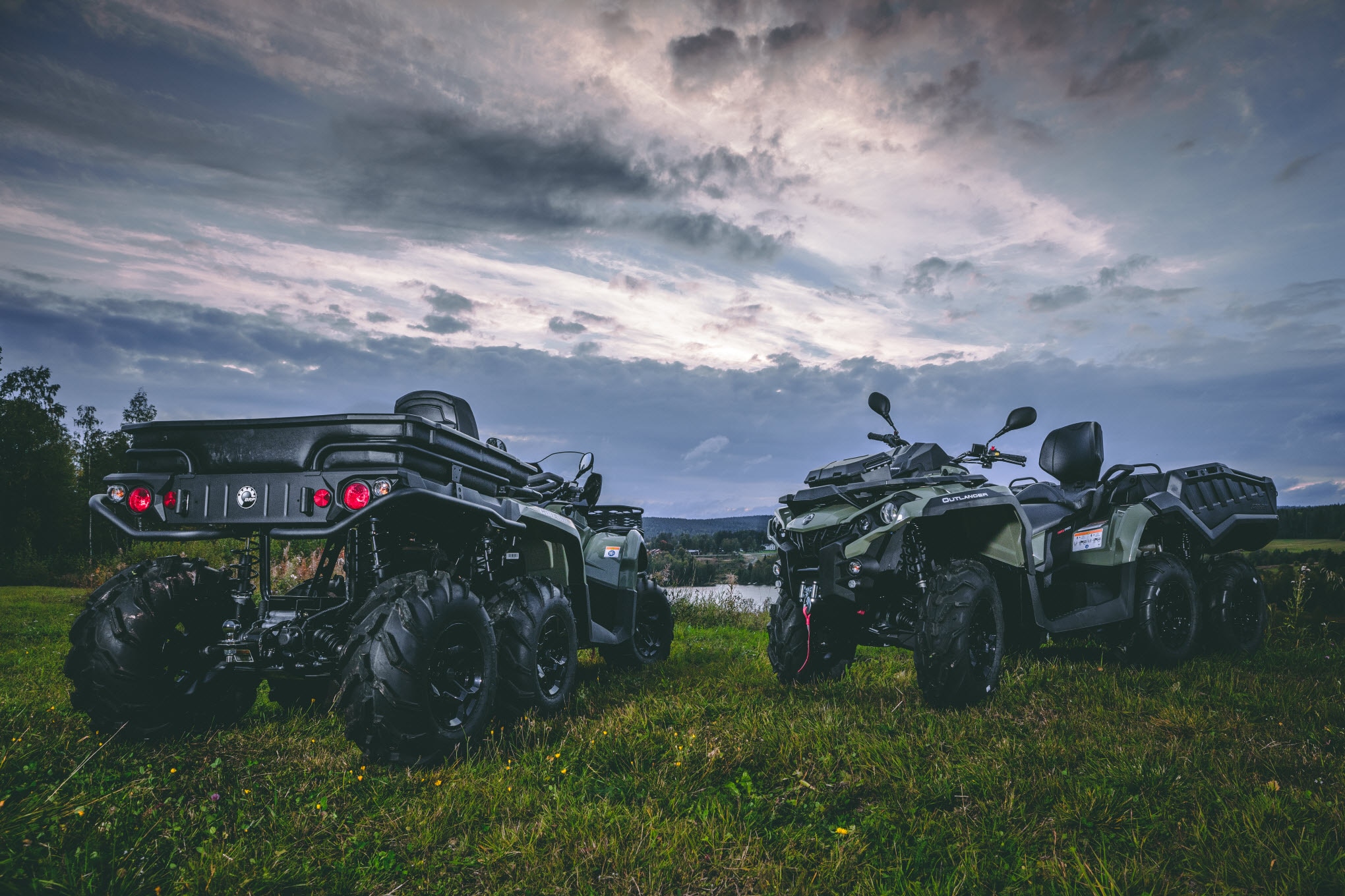 Men getting ready for a trip with Can-Am ATV and SSV vehicles