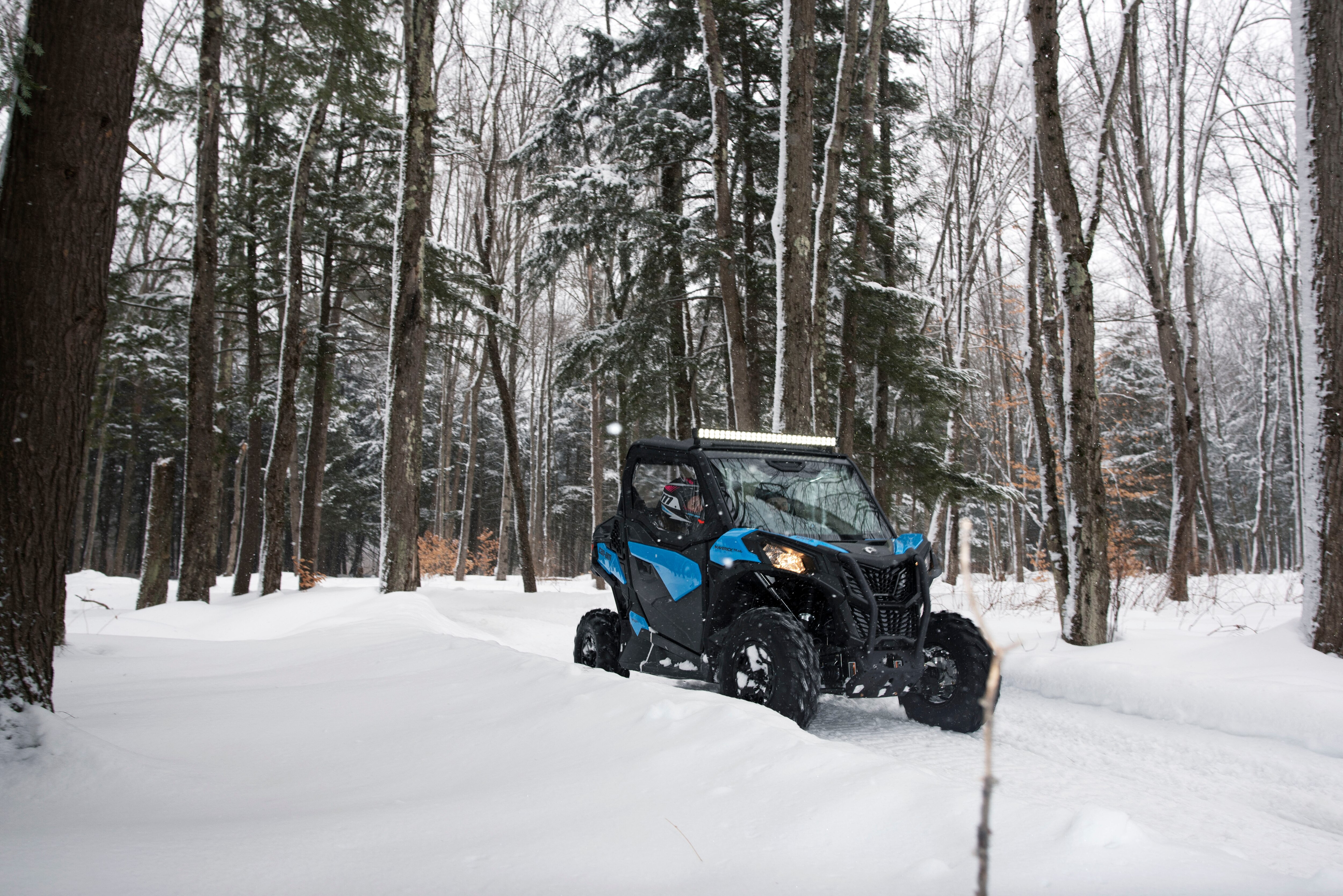 Can-Am Maverick Trail having fun in a wintery forest
