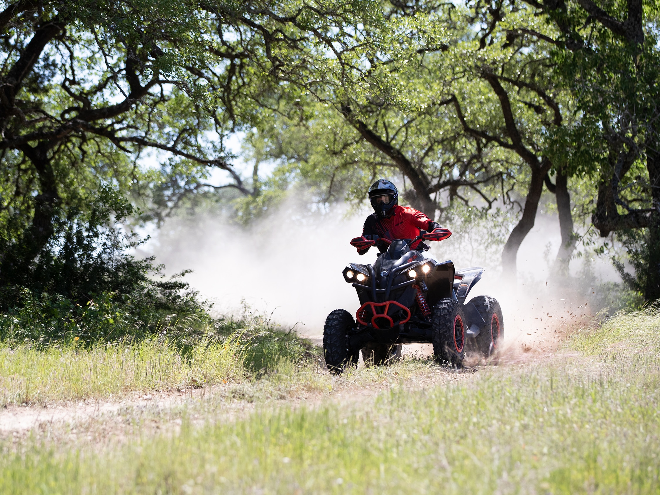 Man riding a Can-Am Renegade X xc ATV in a trail