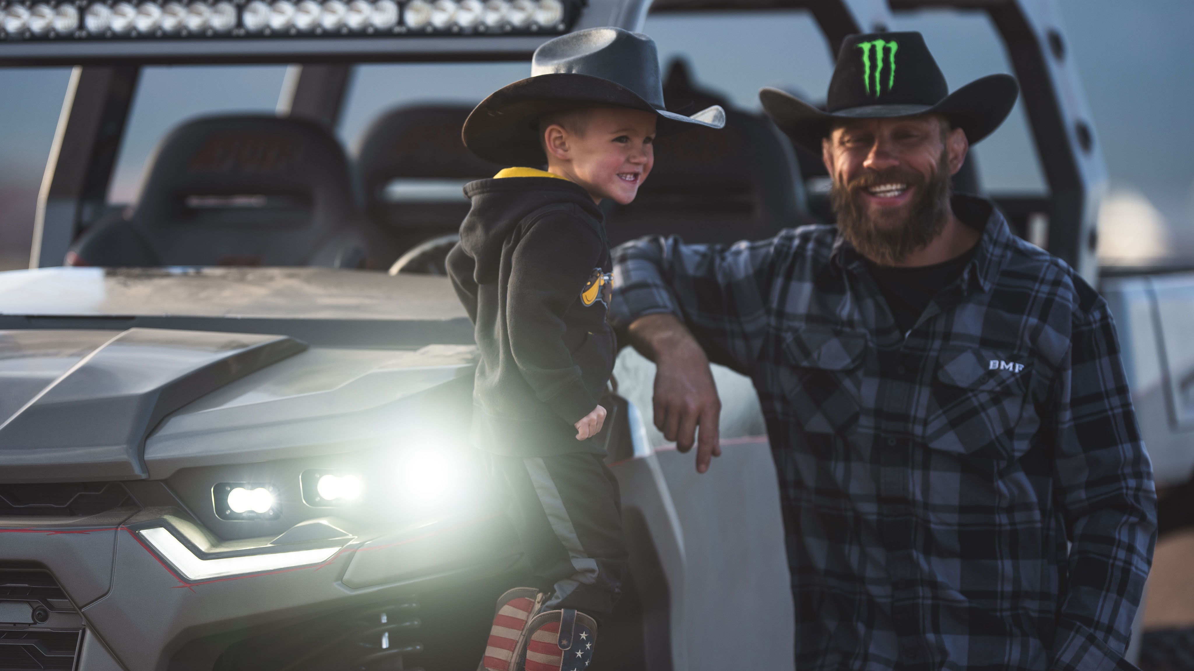 Donald Cerrone with son and his Defender MAX 6x6