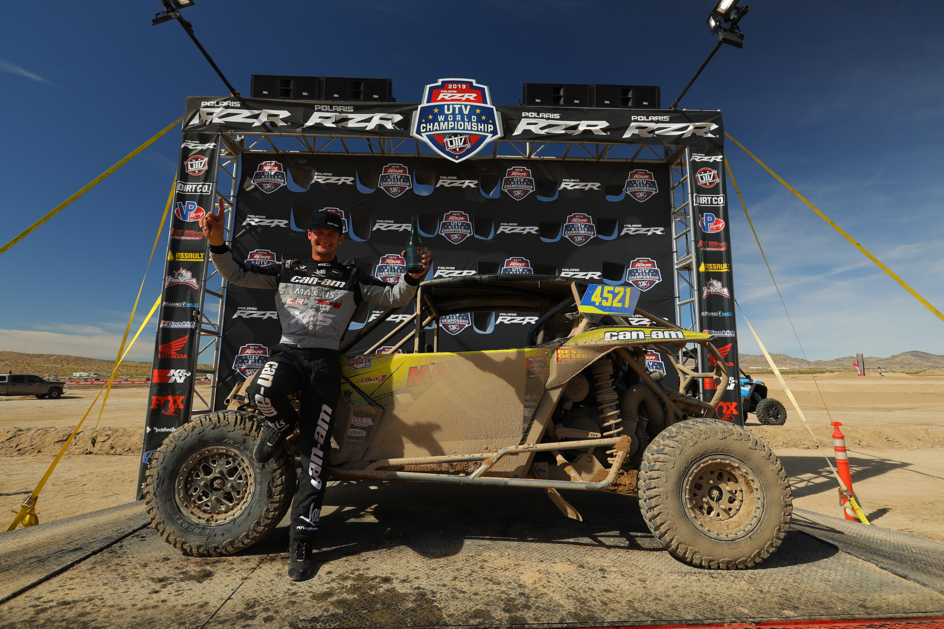 Cody Miller posing with his SxS vehicle