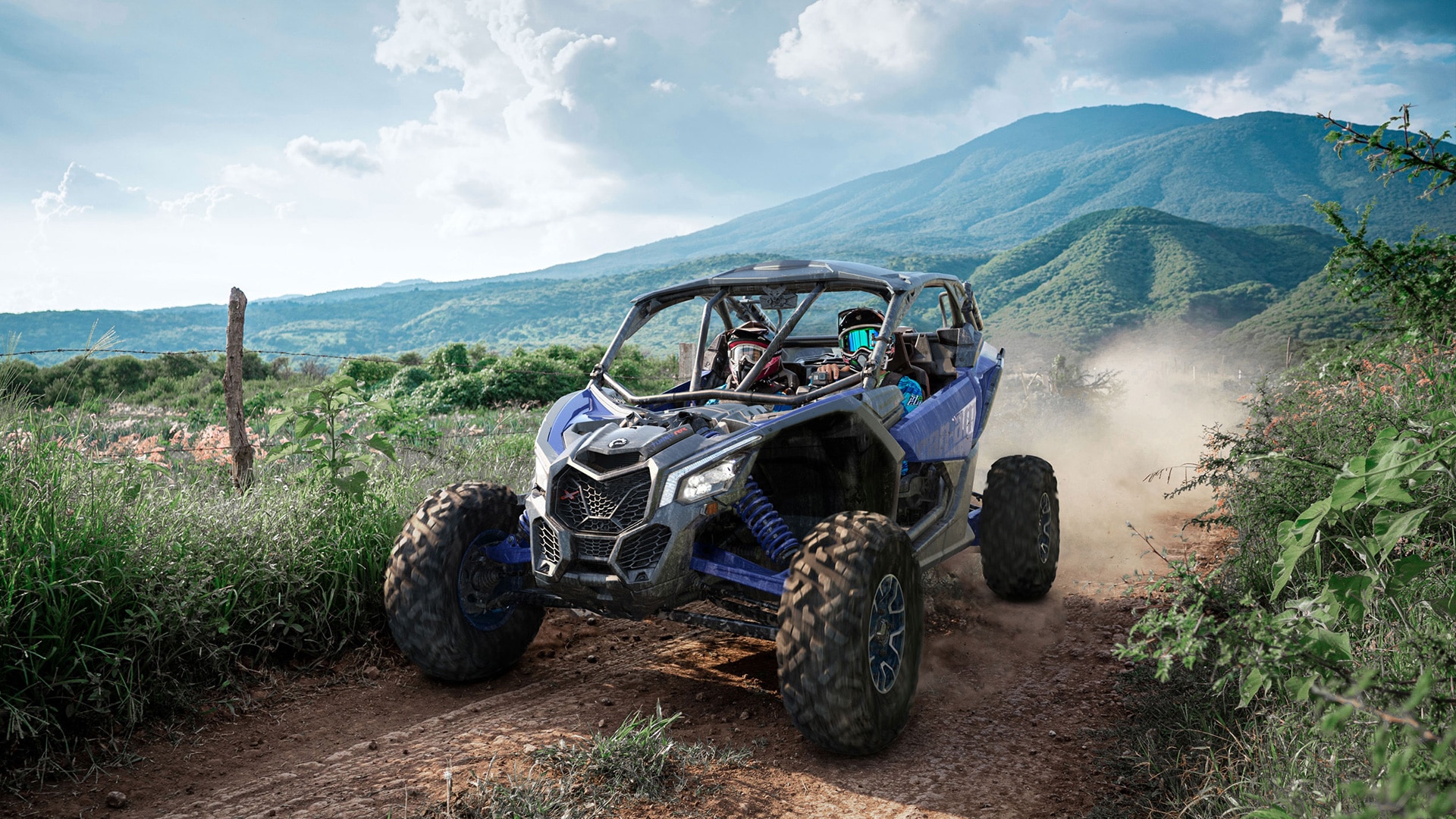 2 people driving a Can-Am Maverick X3 in a off-road trail