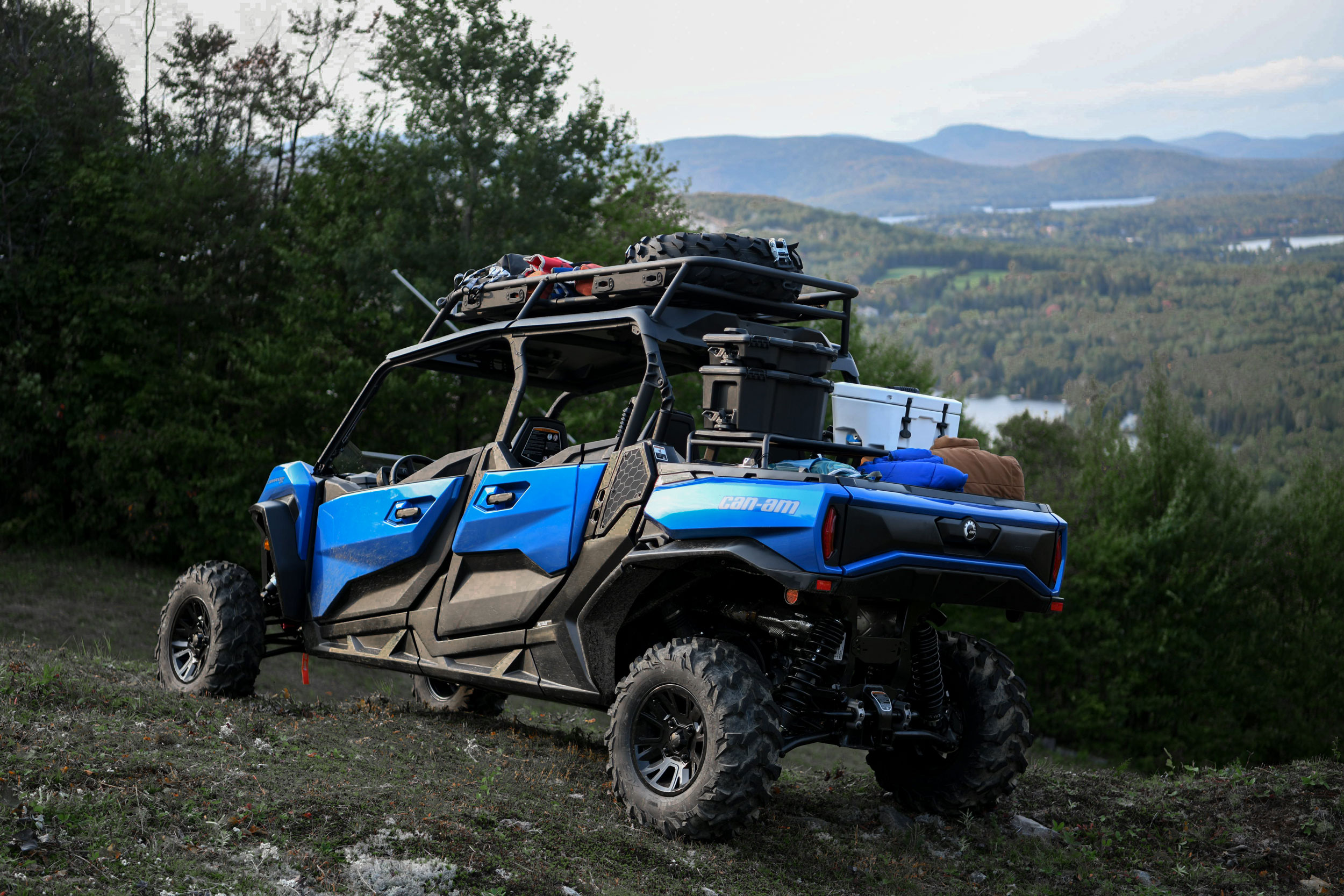 Can-Am Off-Road Commander 2024 side by side vehicle with accessories on cottage trail 