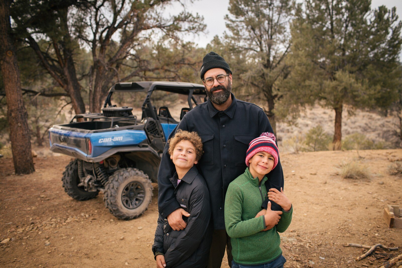 Billy Parks with his sons, posing for a photo on an adventure with their Oxford Blue Can-Am Commander MAX XT