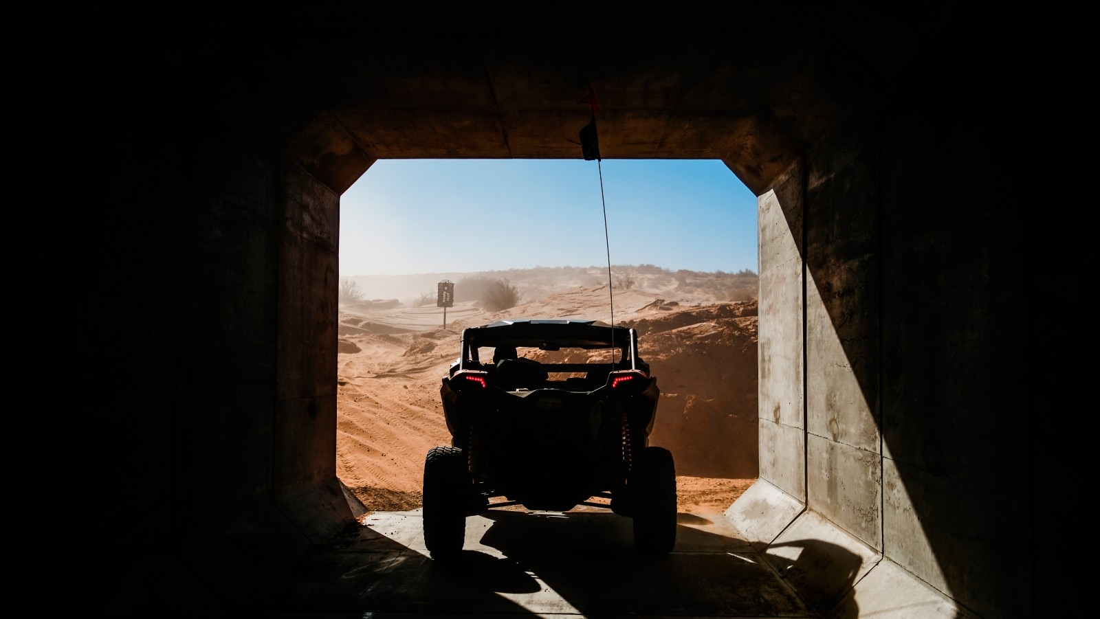 A back view of a Can-Am SxS in a tunnel