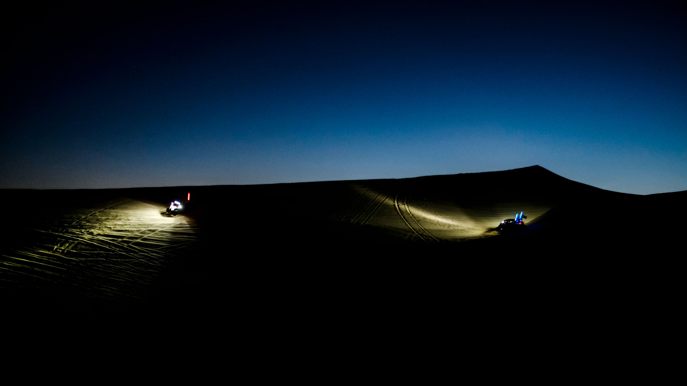 A Can-Am SxS light shining in the dark