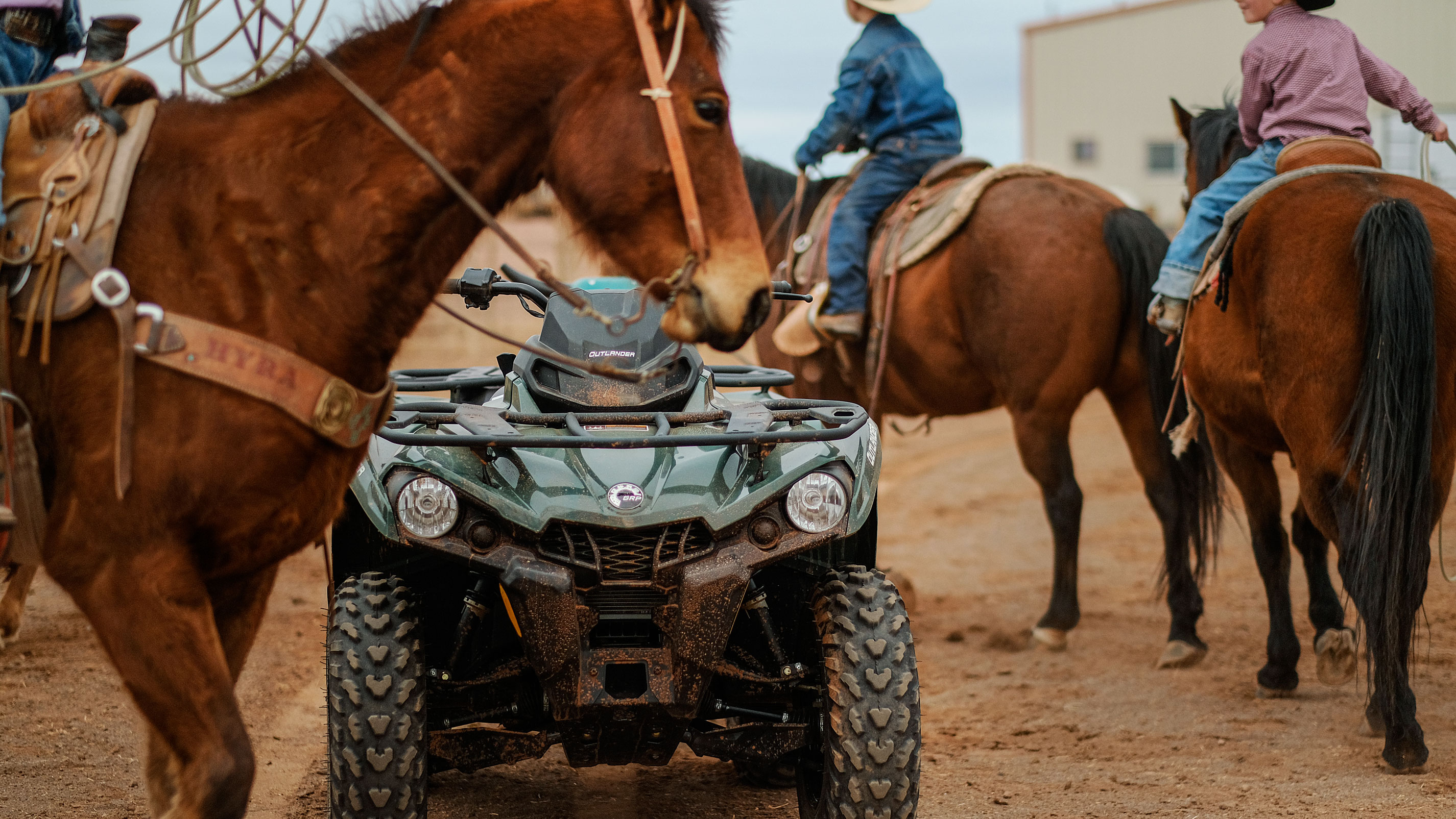 The front of a Can-Am ATV on a ranch