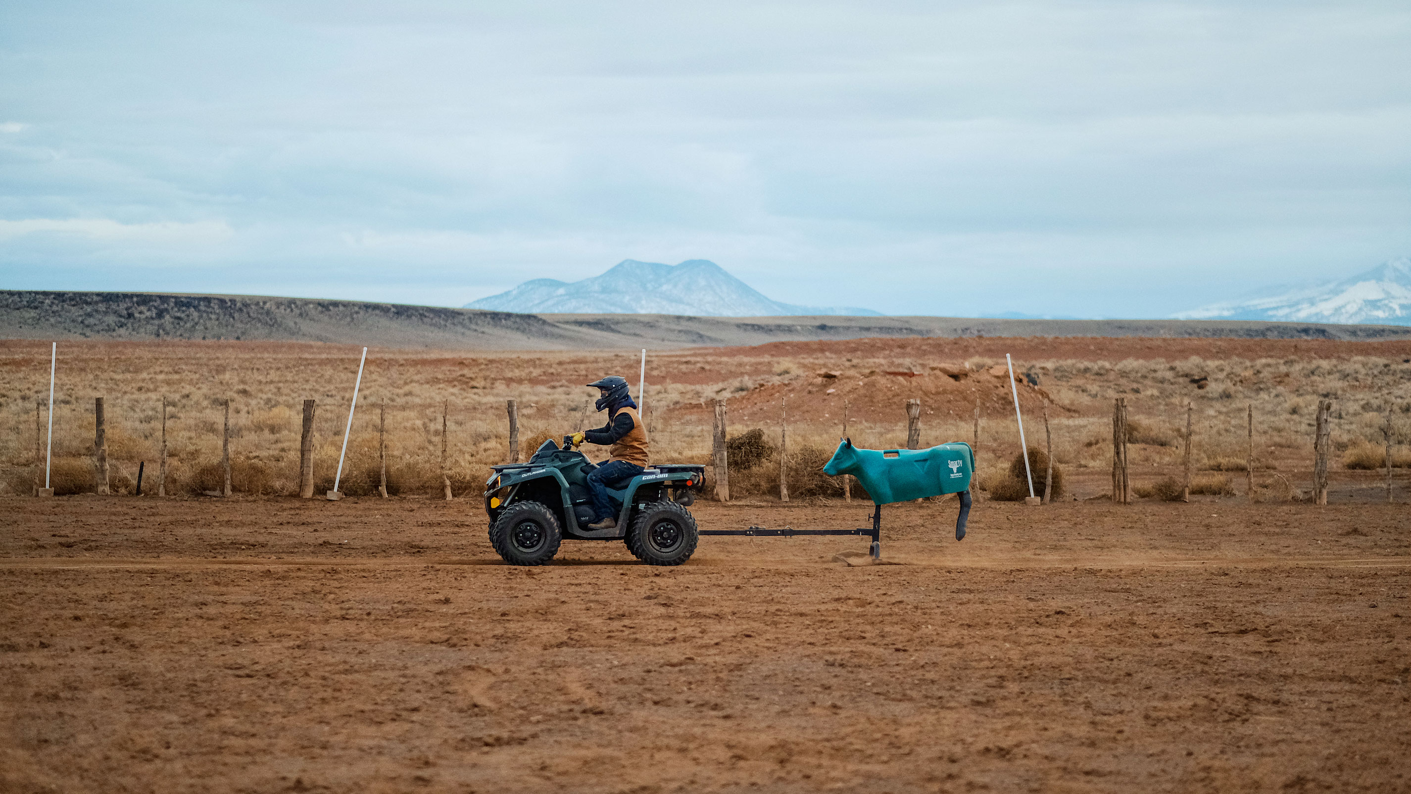 A rider using a Can-Am ATV on a ranch