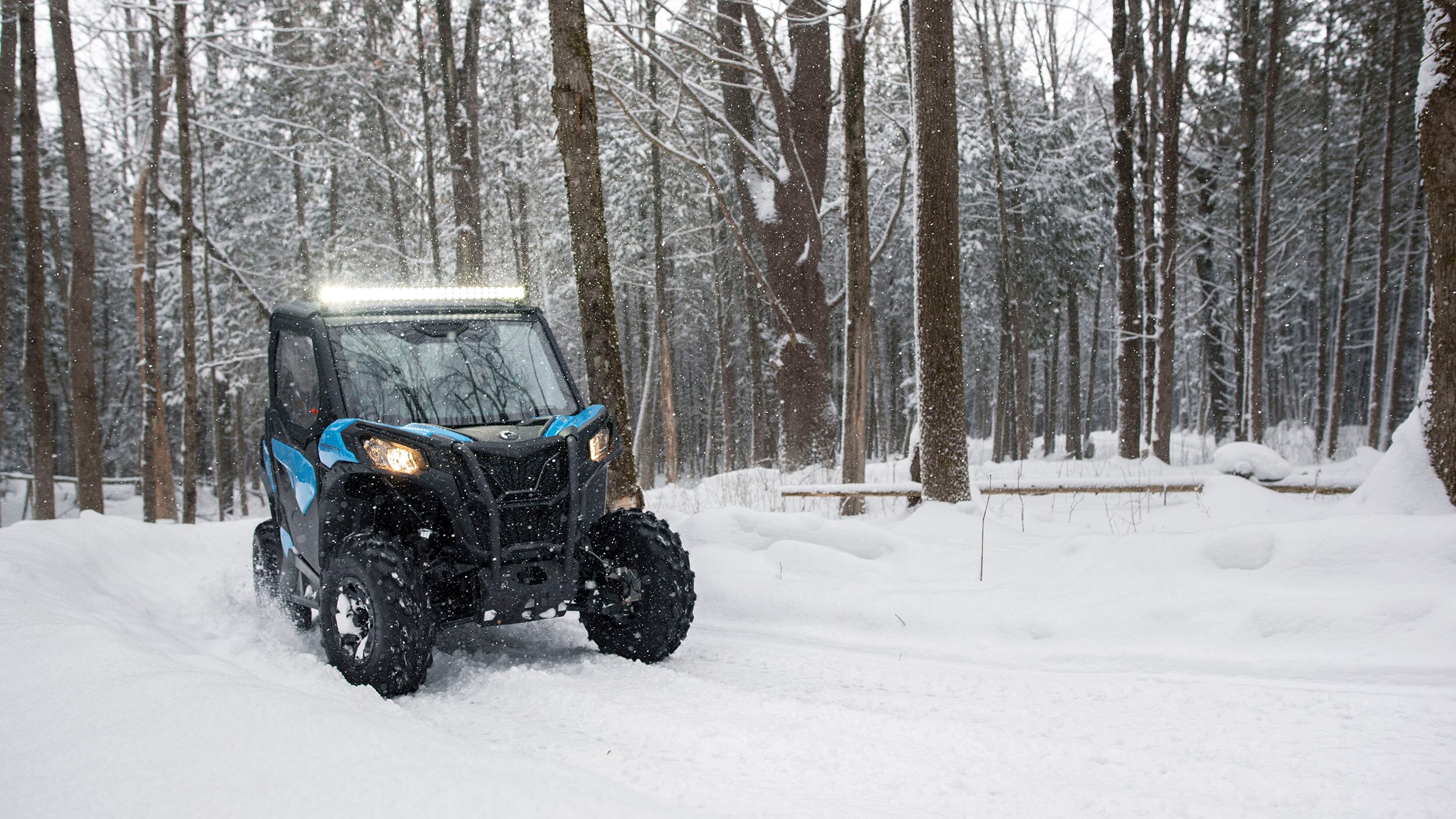 A full view of a Can-Am Maverick trail in a snowy day