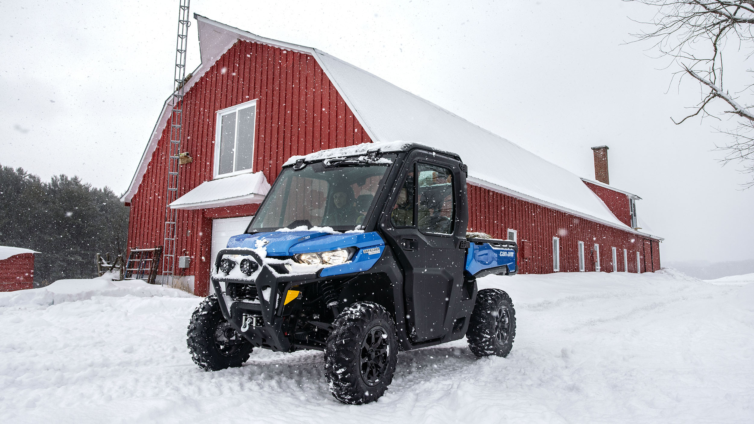 A Can-Am Defender in front of a building