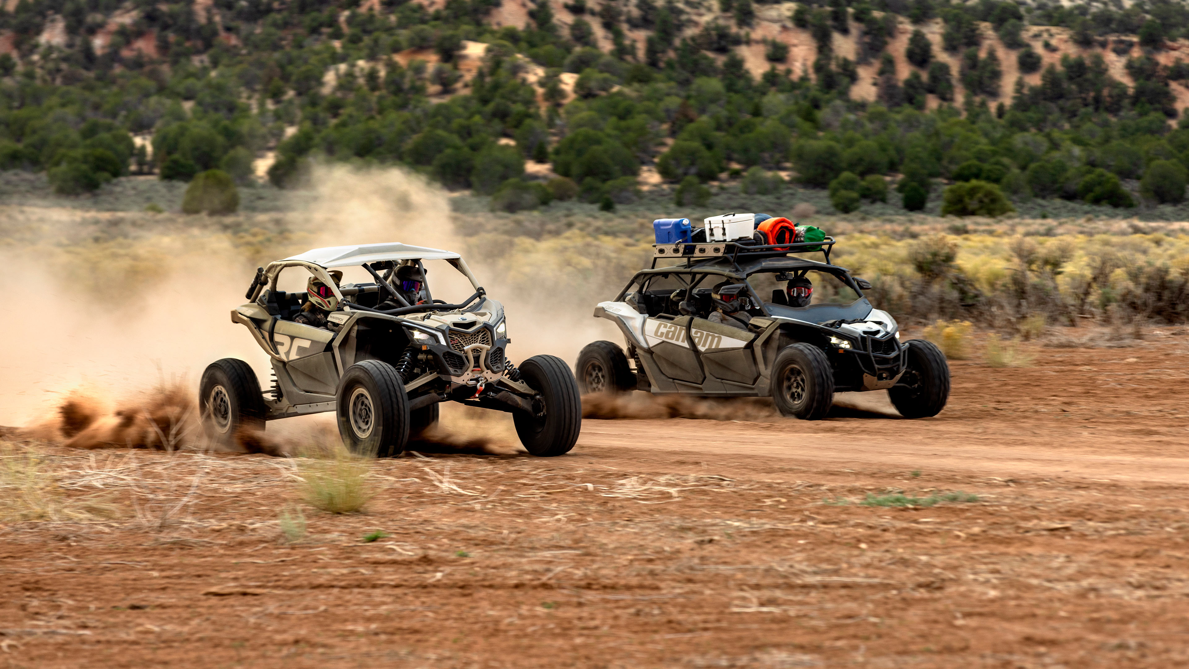 Can-Am side-by-sides driving on a trail