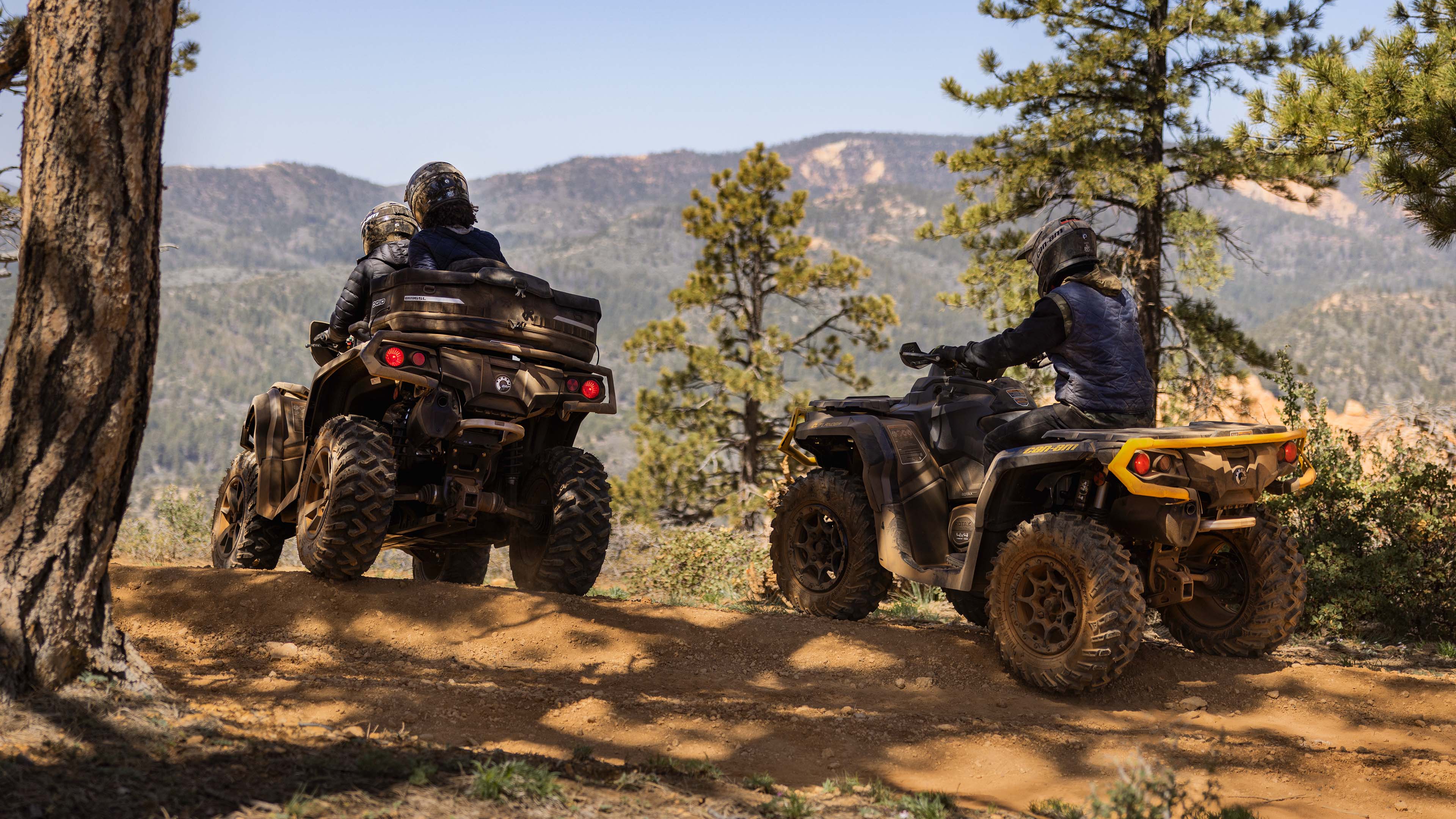 A Can-Am Outlander XT 850 and Outlander XT-P 1000R following each other in an adventure setting
