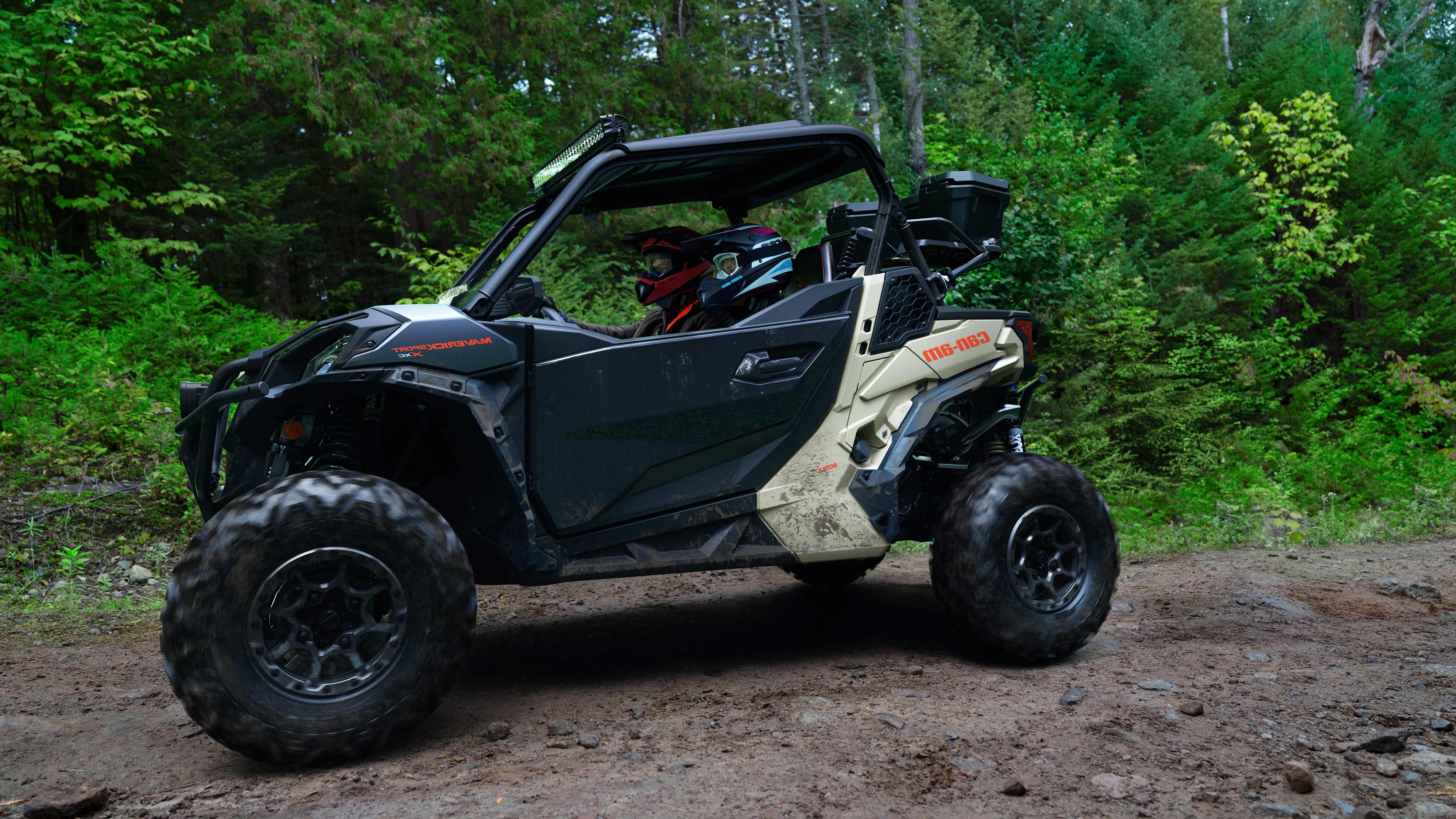 Side view of a Maverick Sport in a wooded area