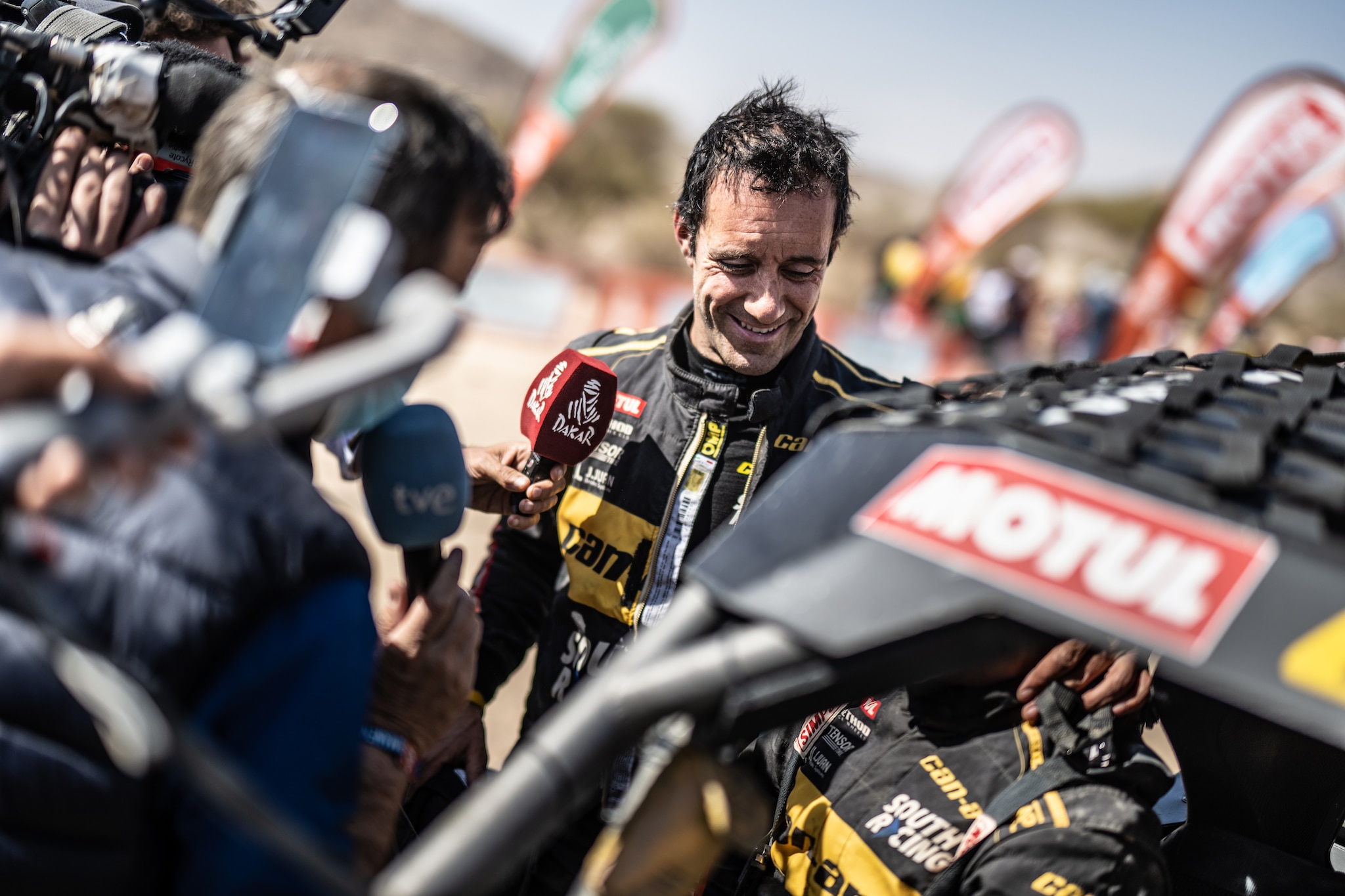 Gerard Farres in front of his maverick and the cameras during the Dakar 2023