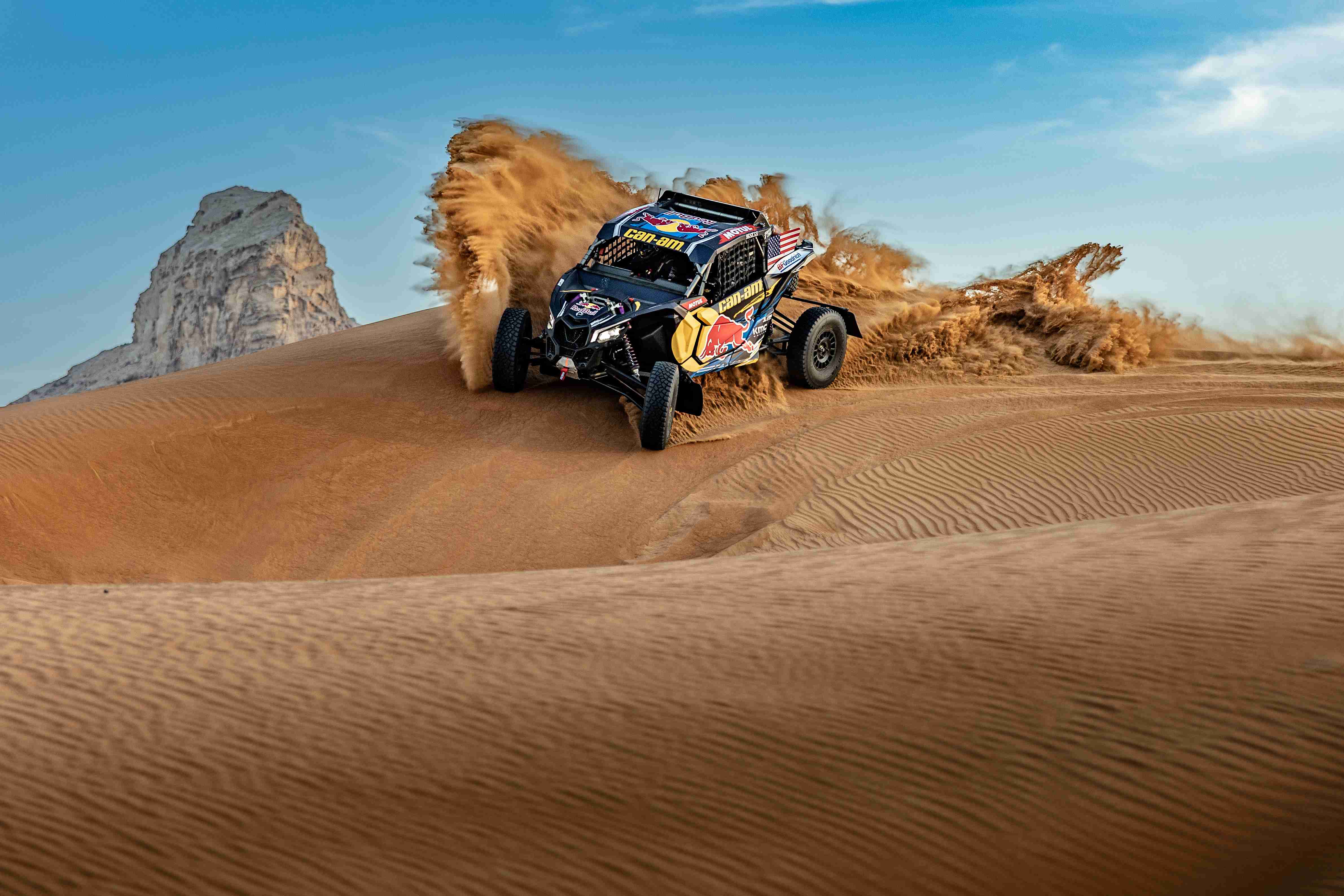 Maverick riding on a sand dune in the desert