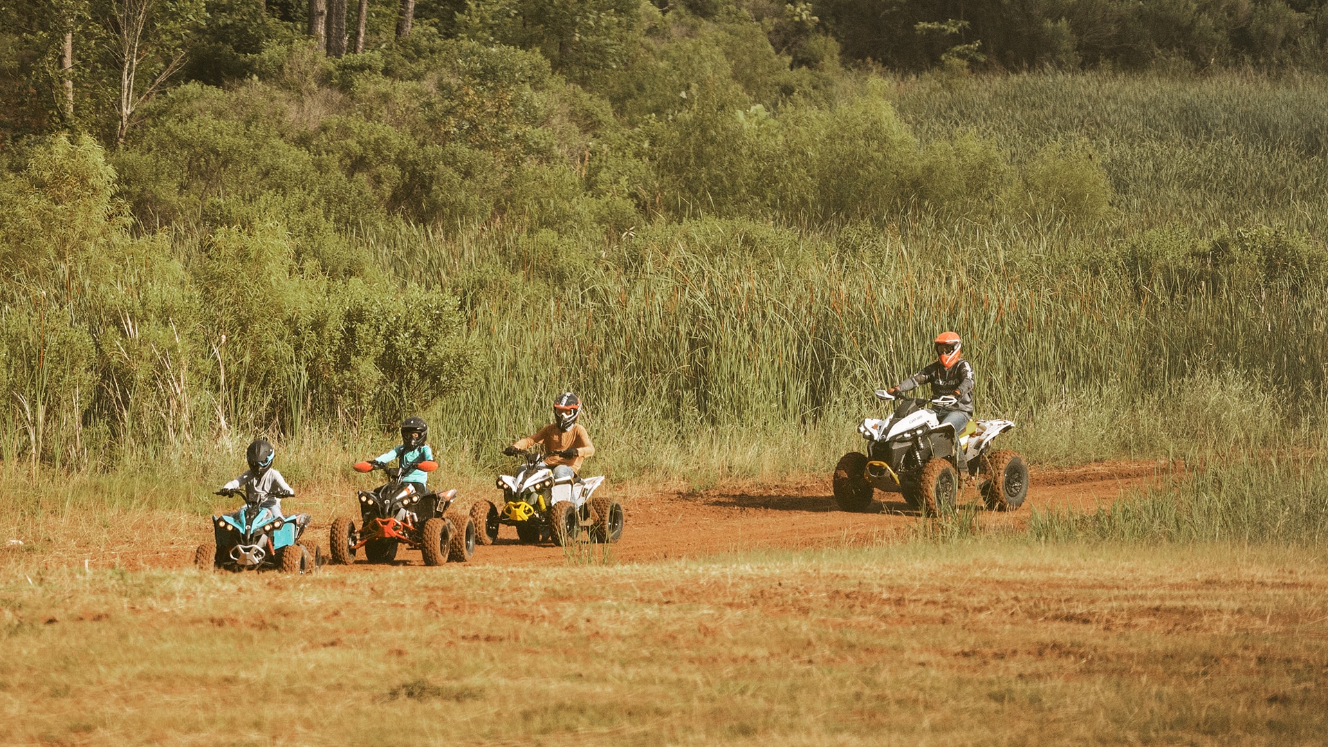 Can-Am riders driving in a line