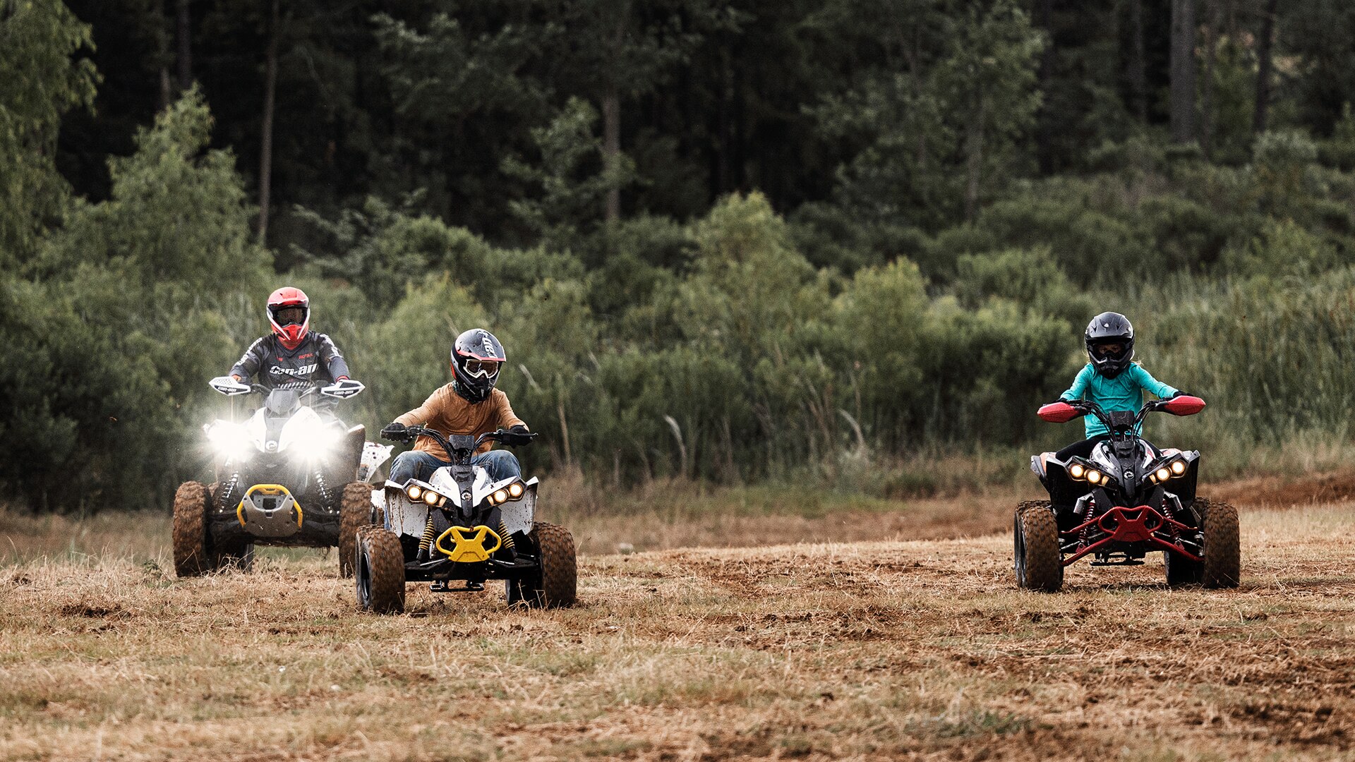 Can-Am riders driving around on ATVs