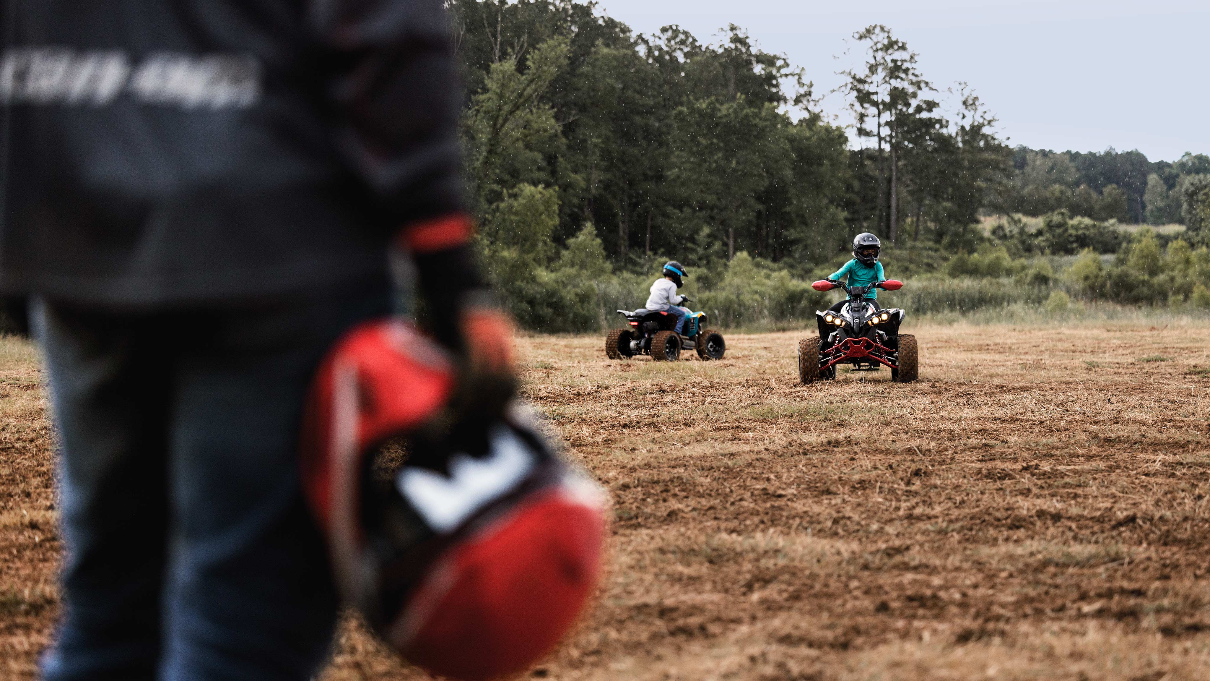 Supervising two young ATV riders