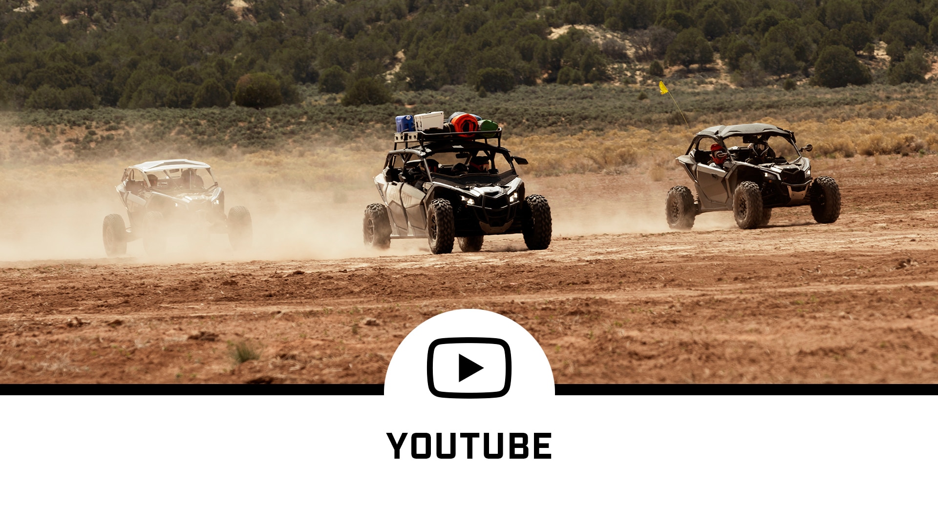 Three Can-Am vehicles on a patch of dirt and a YouTube social media logo