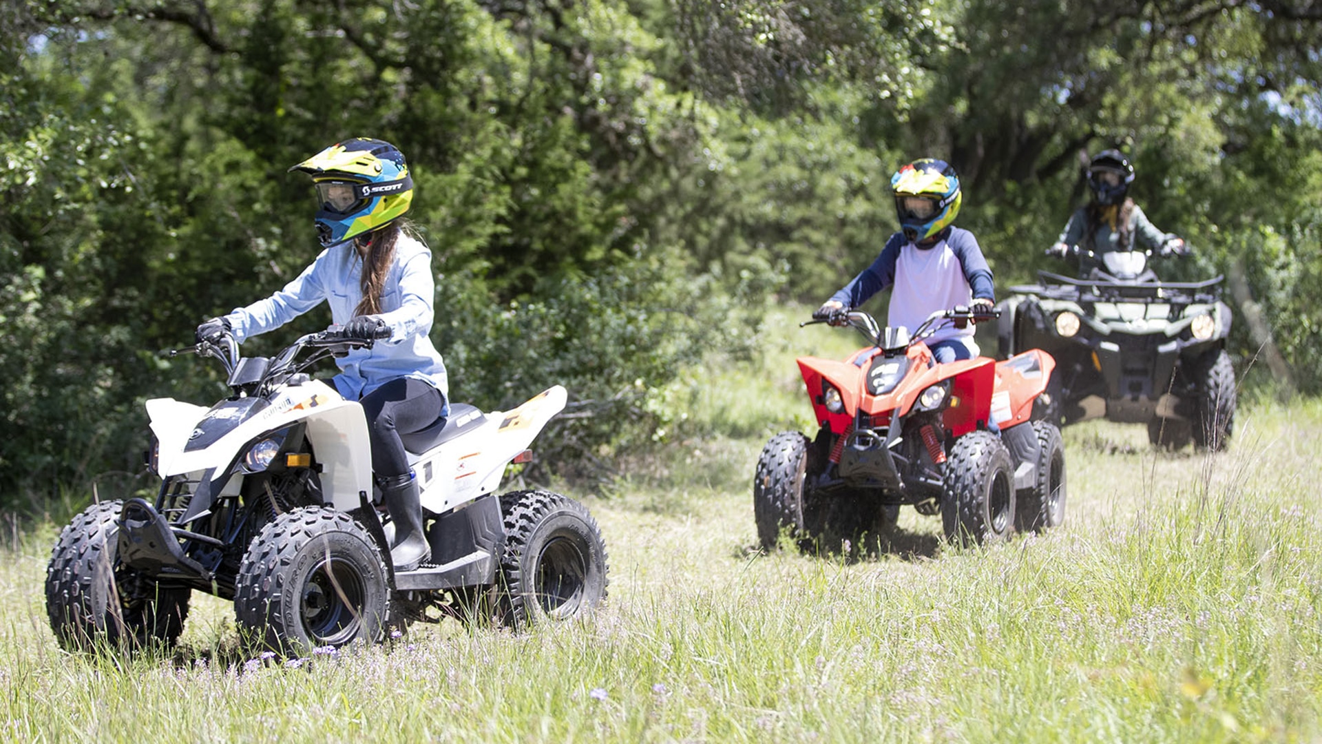 Kids riding on their Can-Am Off-Road DS ATVs