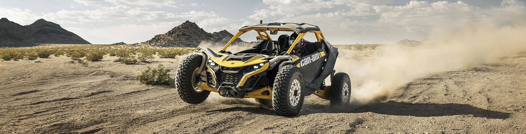 A rider driving a Can-Am Maverick R in the desert