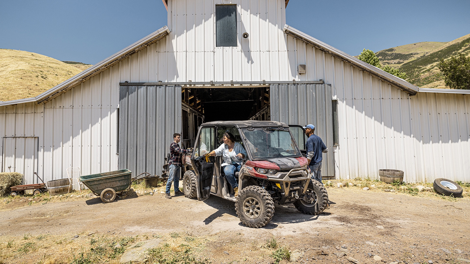 Three farmers in a 4-seater Can-Am Defender Max Limited 