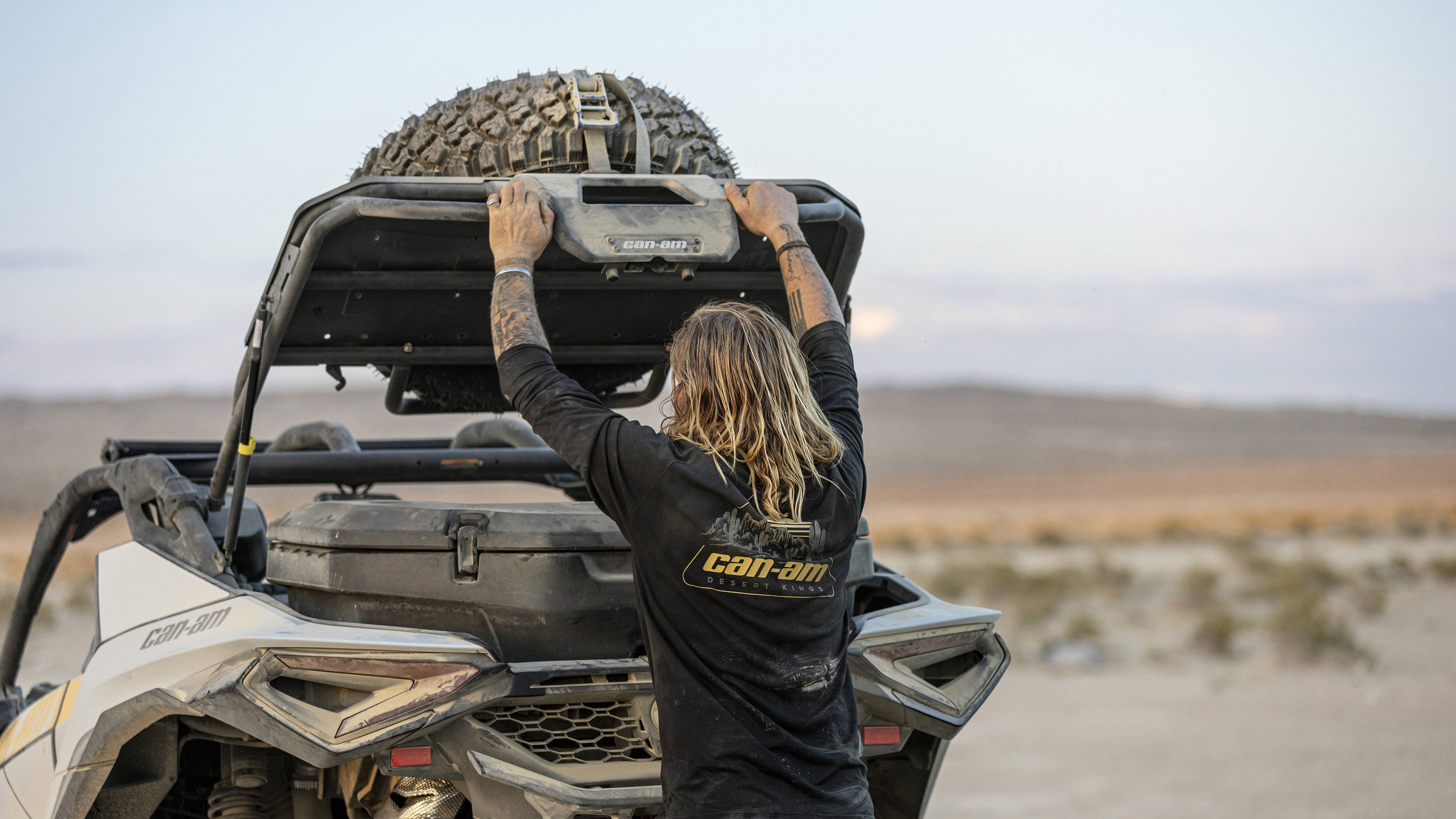 Can-Am ambassador Terry Madden lifting the trunk of his Maverick R SxS to access the LinQ cargo box