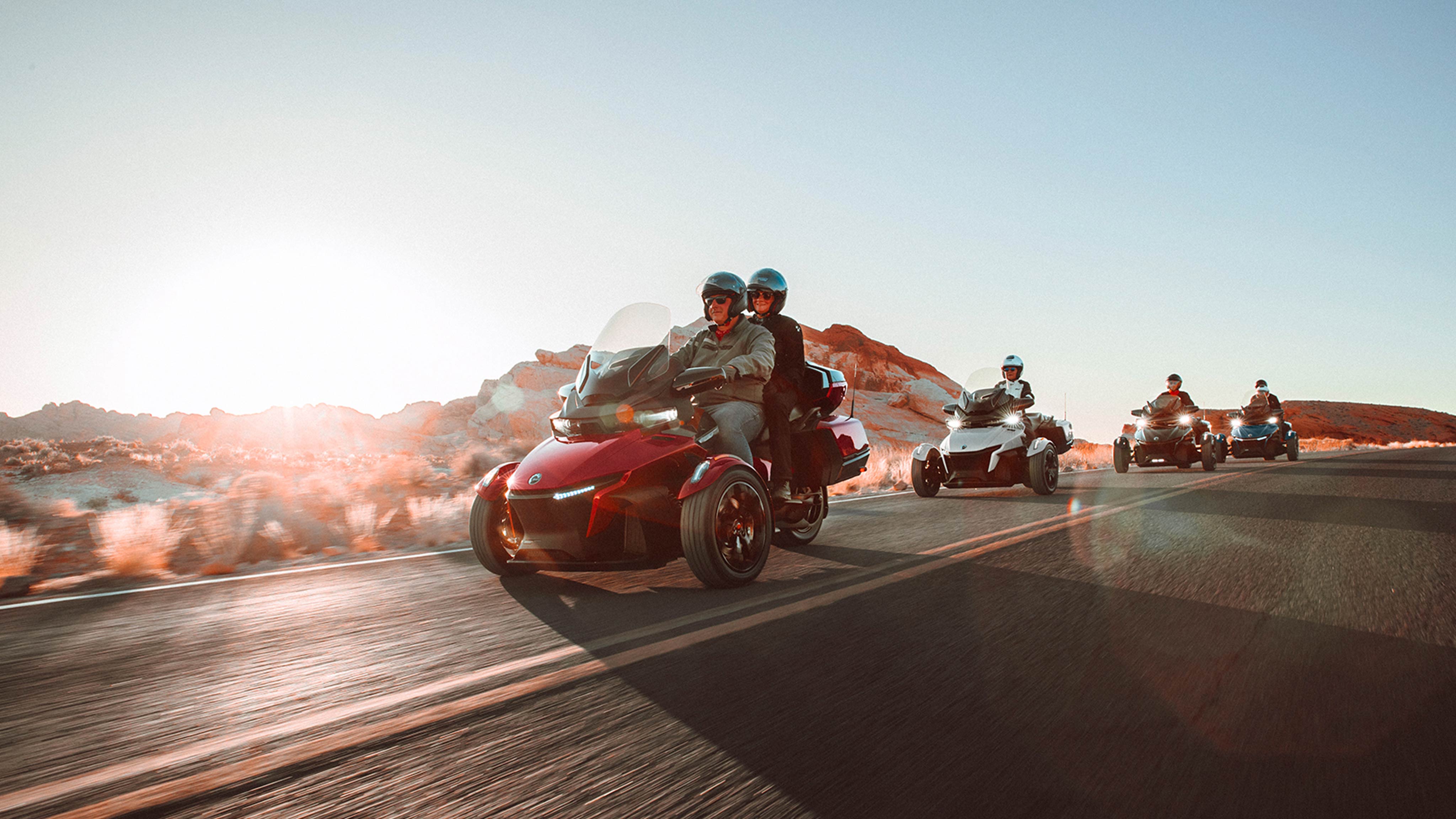 Group of 3-wheel riders riding on their Can-Am On-Road vehicles