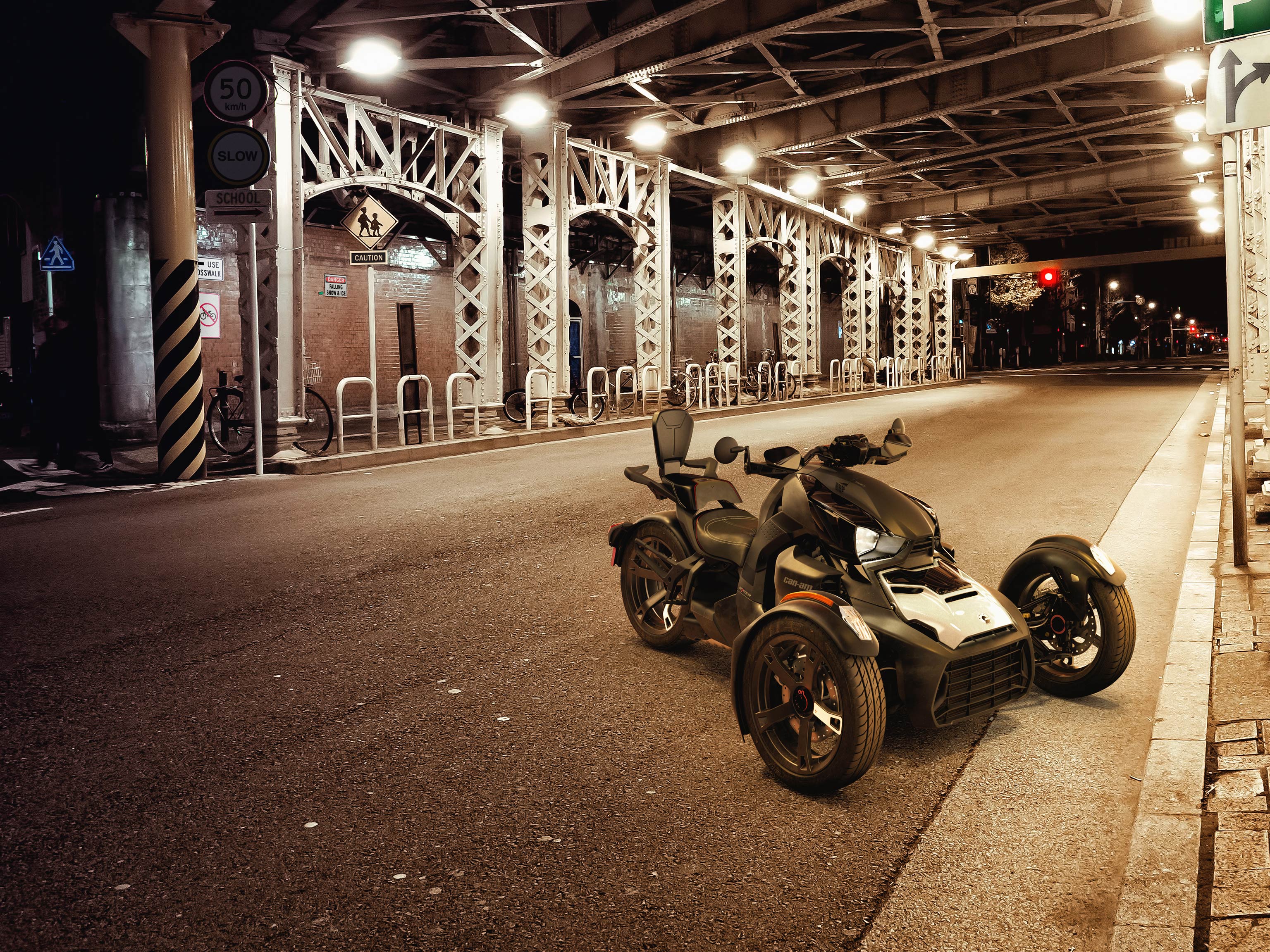 A Can-Am Ryker parked in an underground parking, with a 2-up accessory	