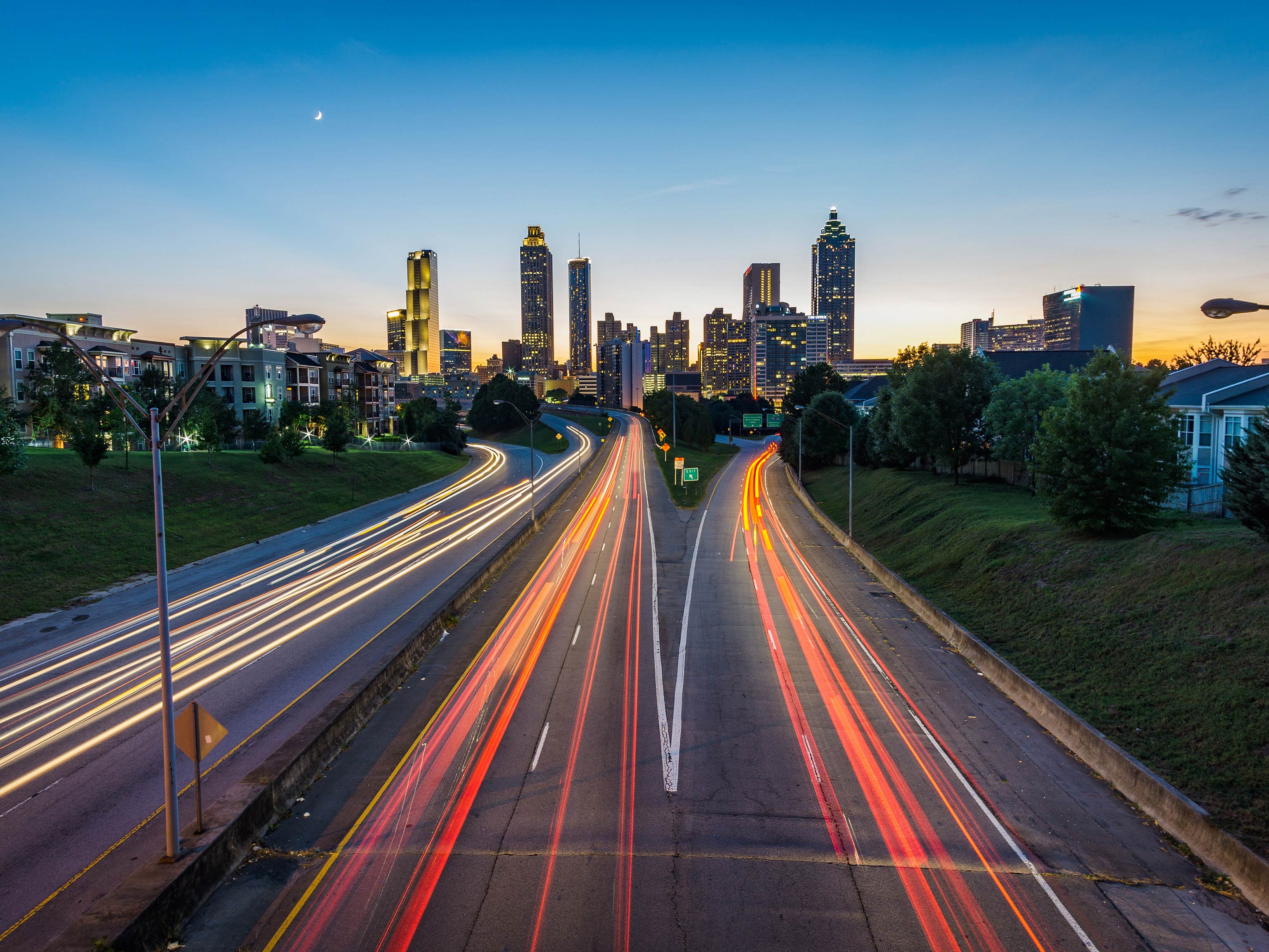 A view of a city's highway at sunset