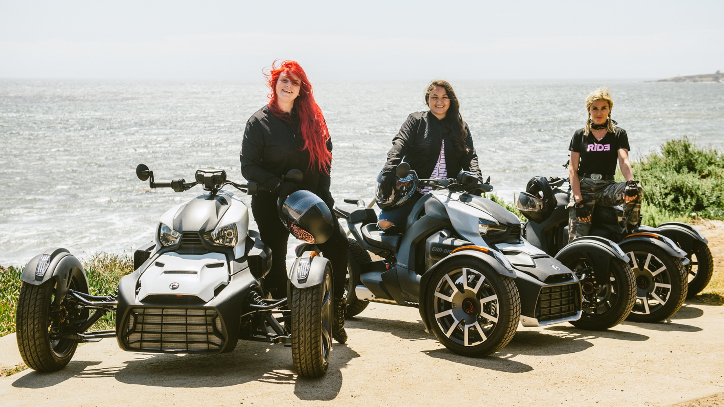 Three women riders on their Can-Am On-Road vehicles