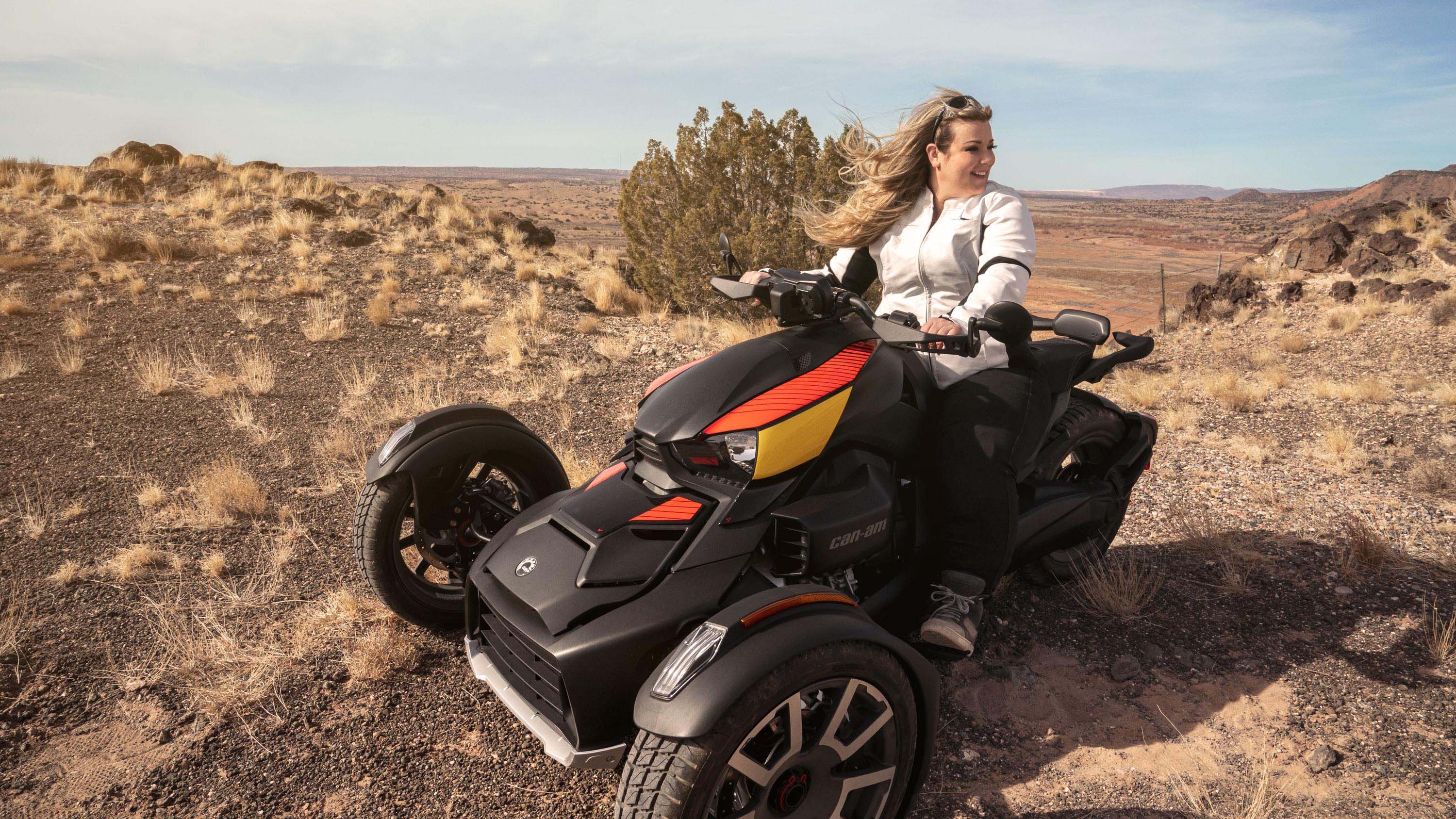 A woman riding her 3-wheel vehicle