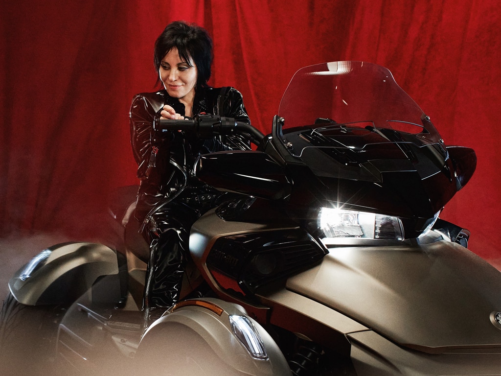 Joan Jett sitting on her Can-Am Sypder F3 3-wheel motorcycle 