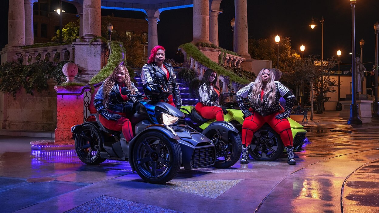 Women riding group posing with their Can-Am Ryker Sport 3-wheel motorcycles