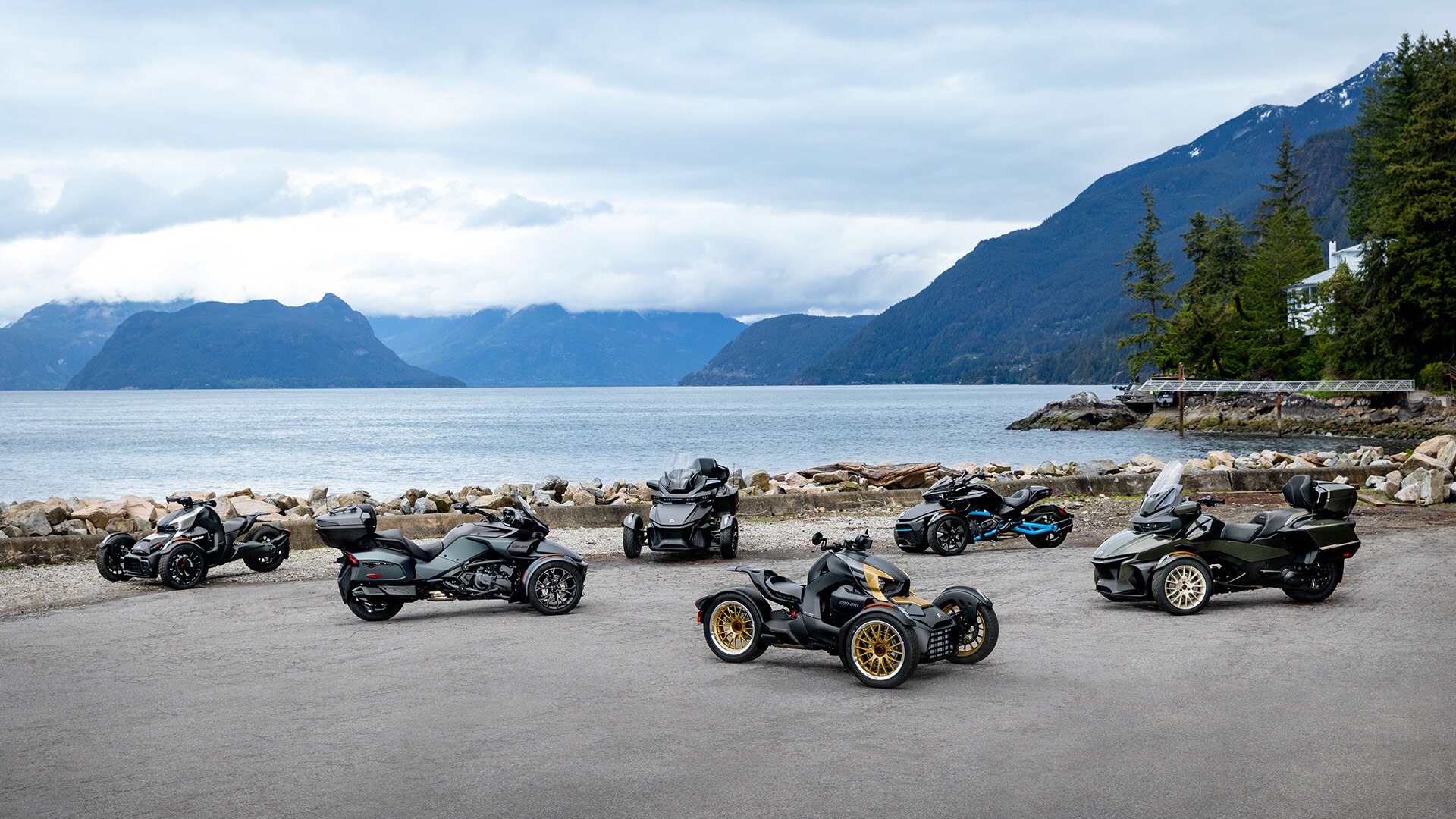 2023 Can-Am Ryker, Spyder and Spyder RT models with a view on the lake and moutains