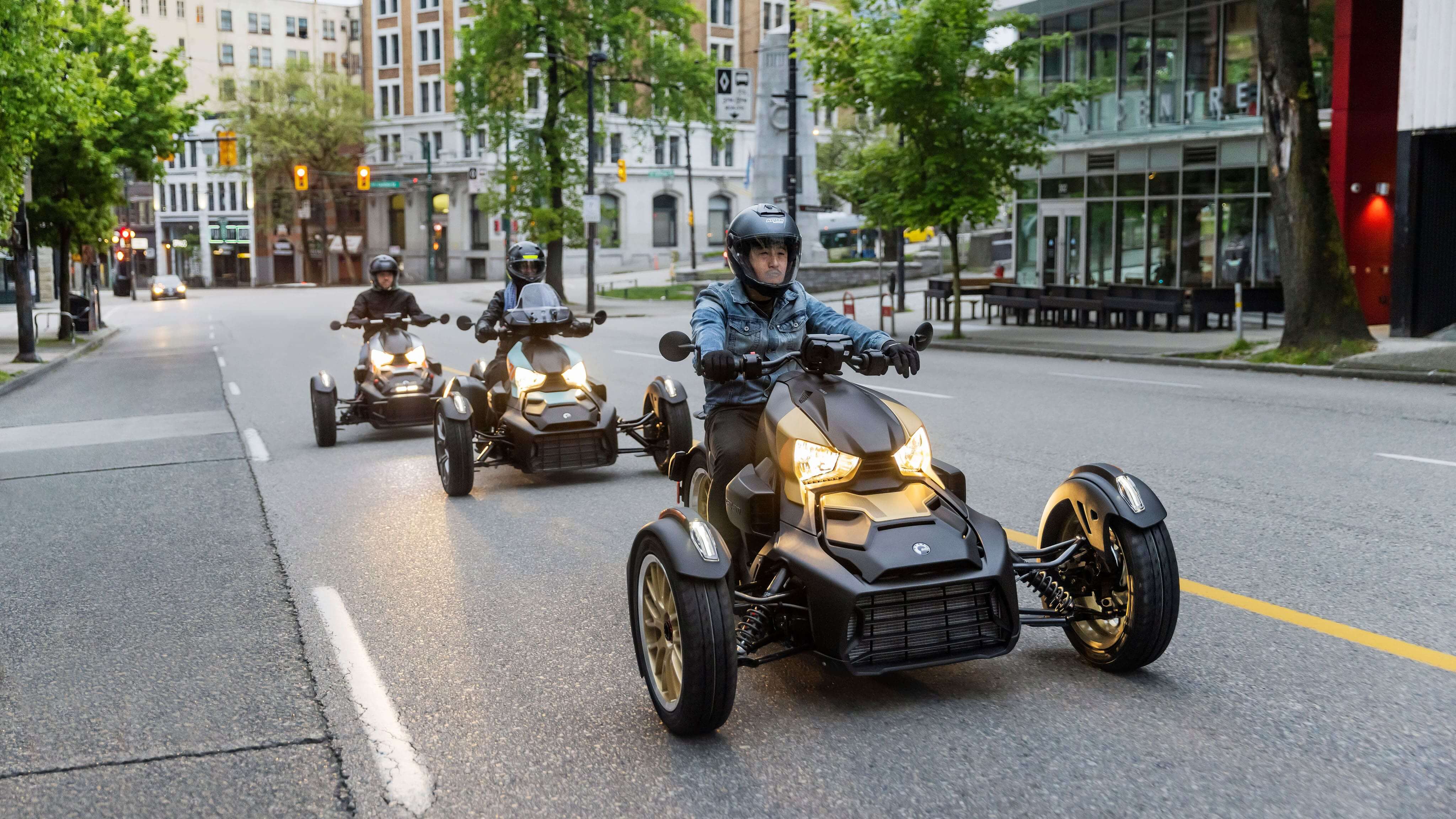 Can-Am Ryker drivers on a street