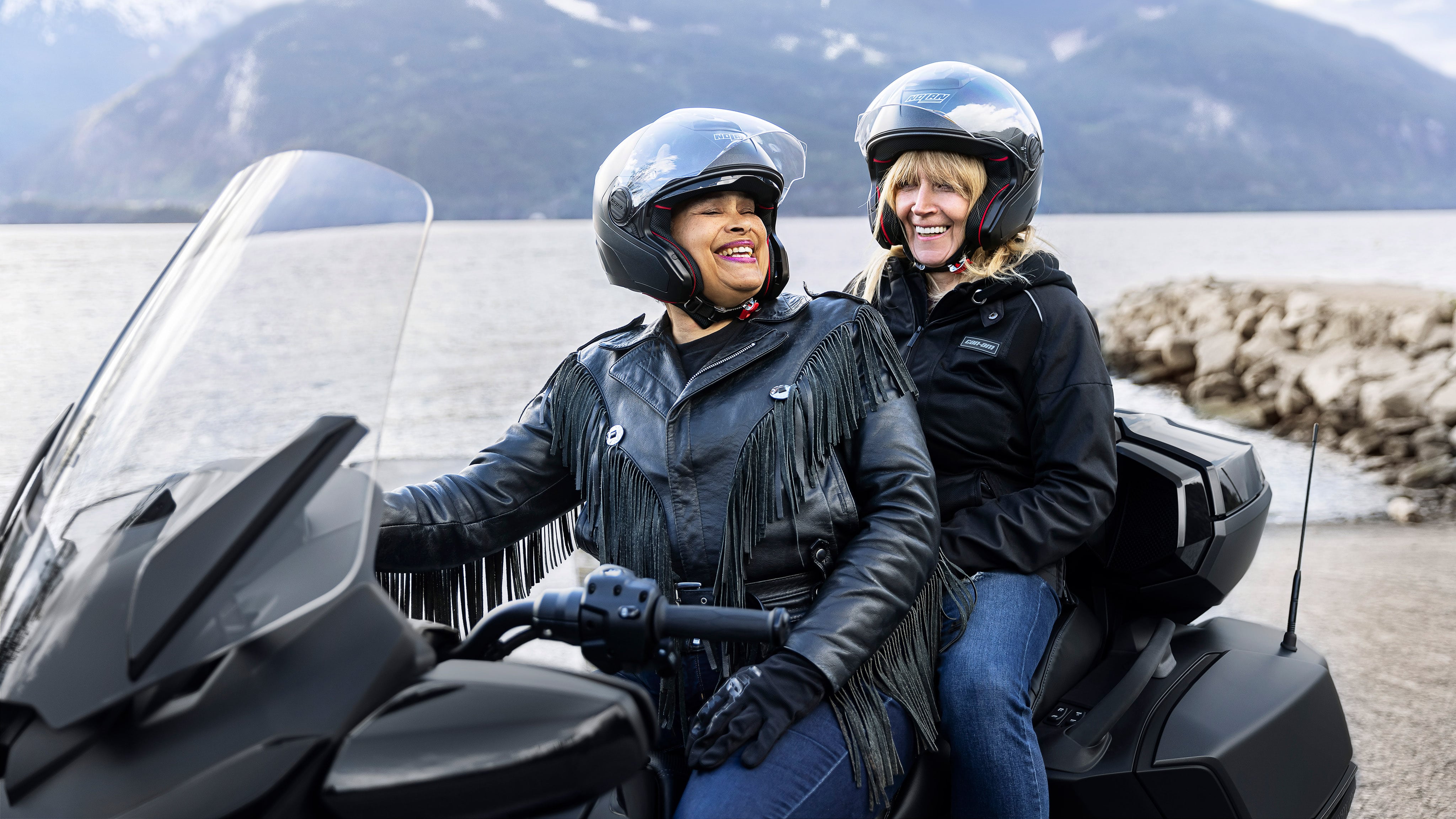 Two female drivers smiling on a Can-Am Spyder RT