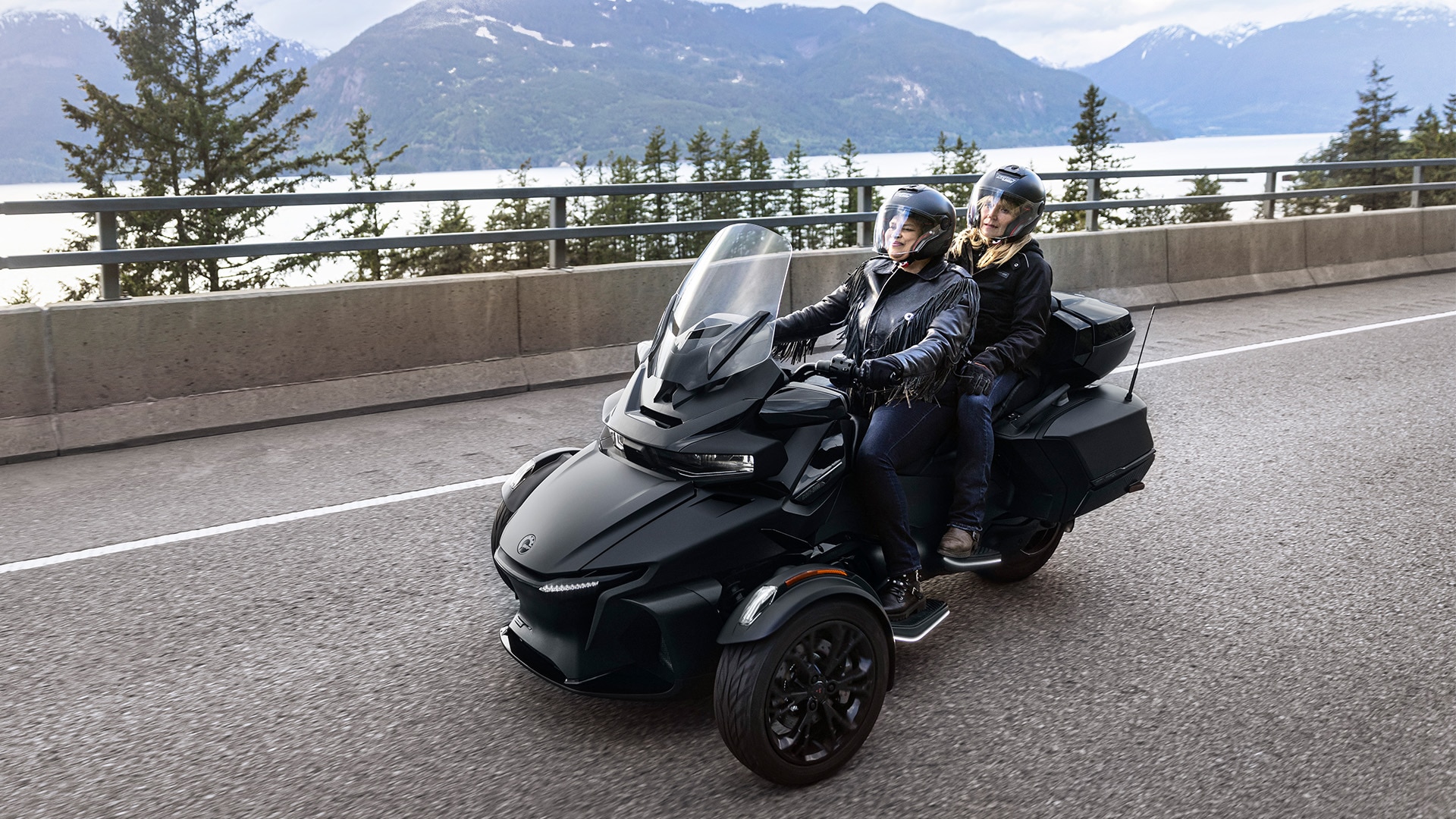 Two female drivers behind the wheel of a 2023 Can-Am Spyder RT