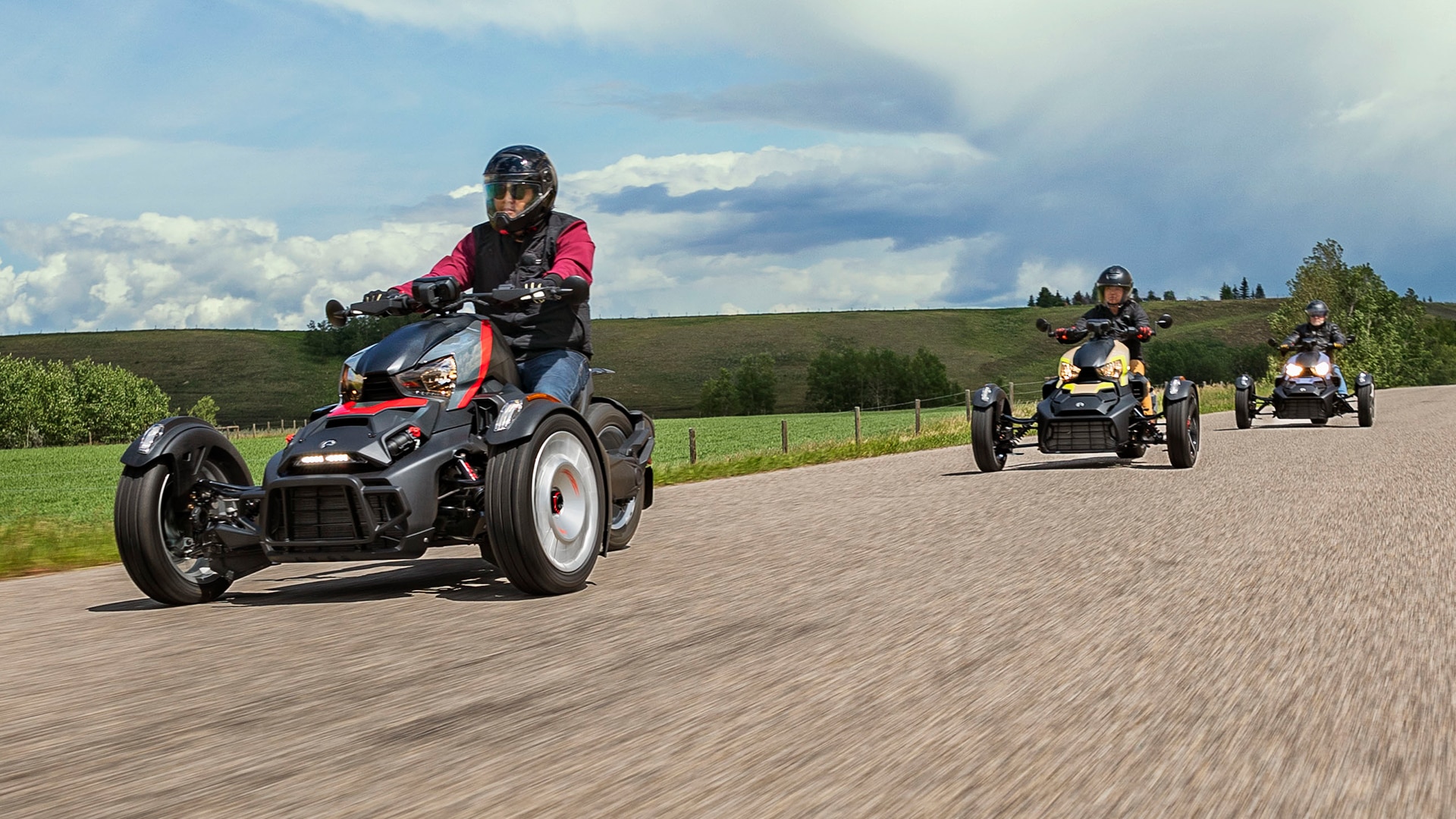 Three drivers on a Can-Am Ryker 2023 on a street road in Vancouver