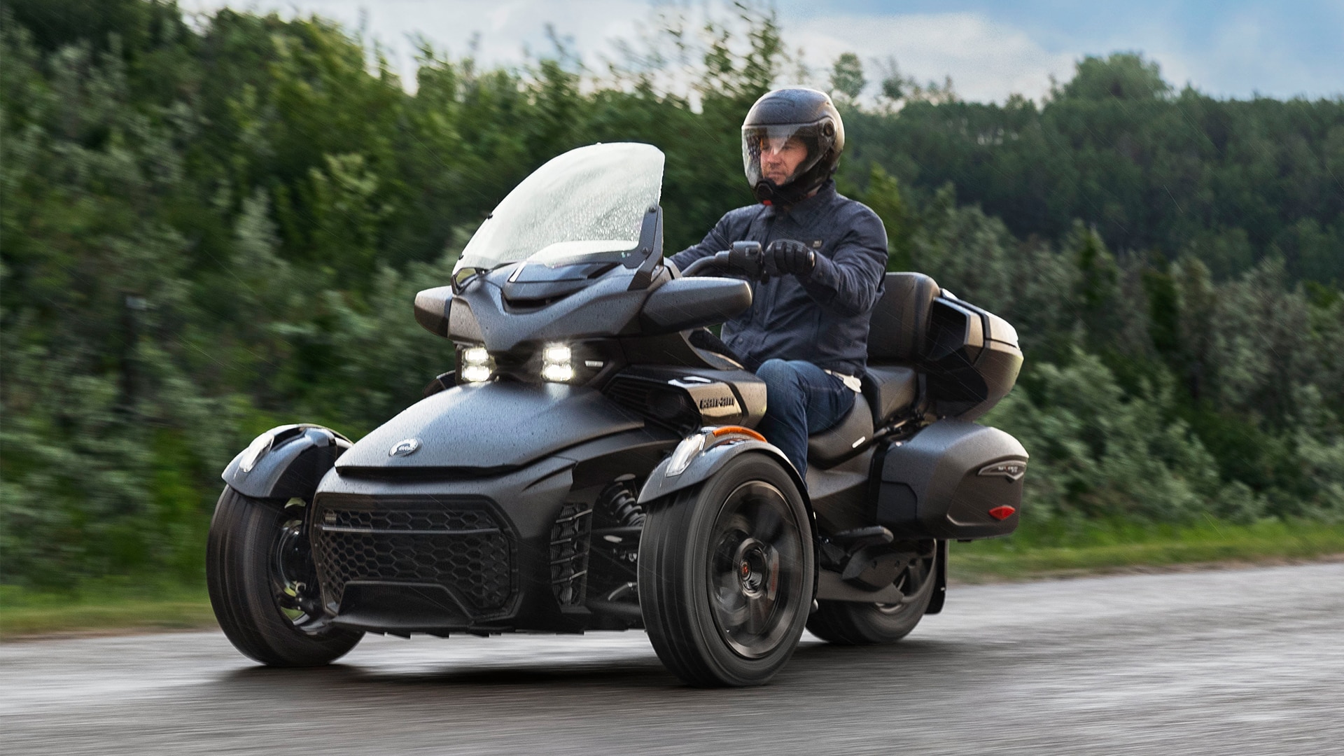Rider riding a Can-Am Spyder F3 in the rain