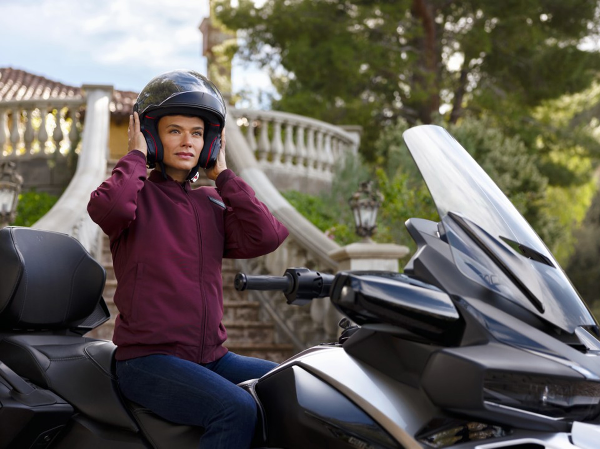 Woman wearing a Can-Am 3-wheel motorcycle helmet