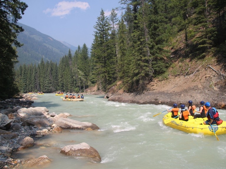 Groups of people rafting in a river
